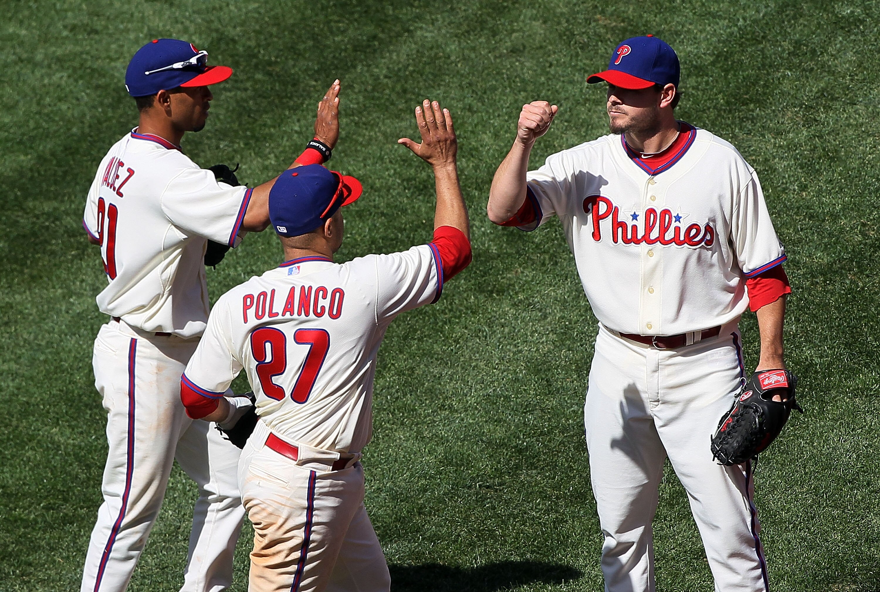 PHILADELPHIA - MAY 06:  Chad Durbin #37 of the Philadelphia Phillies congratulates his teammates Wilson Valdez #21 and Placido Polanco #27 after they completed an eigth inning ending double play against the St. Louis Cardinals at Citizens Bank Park on May