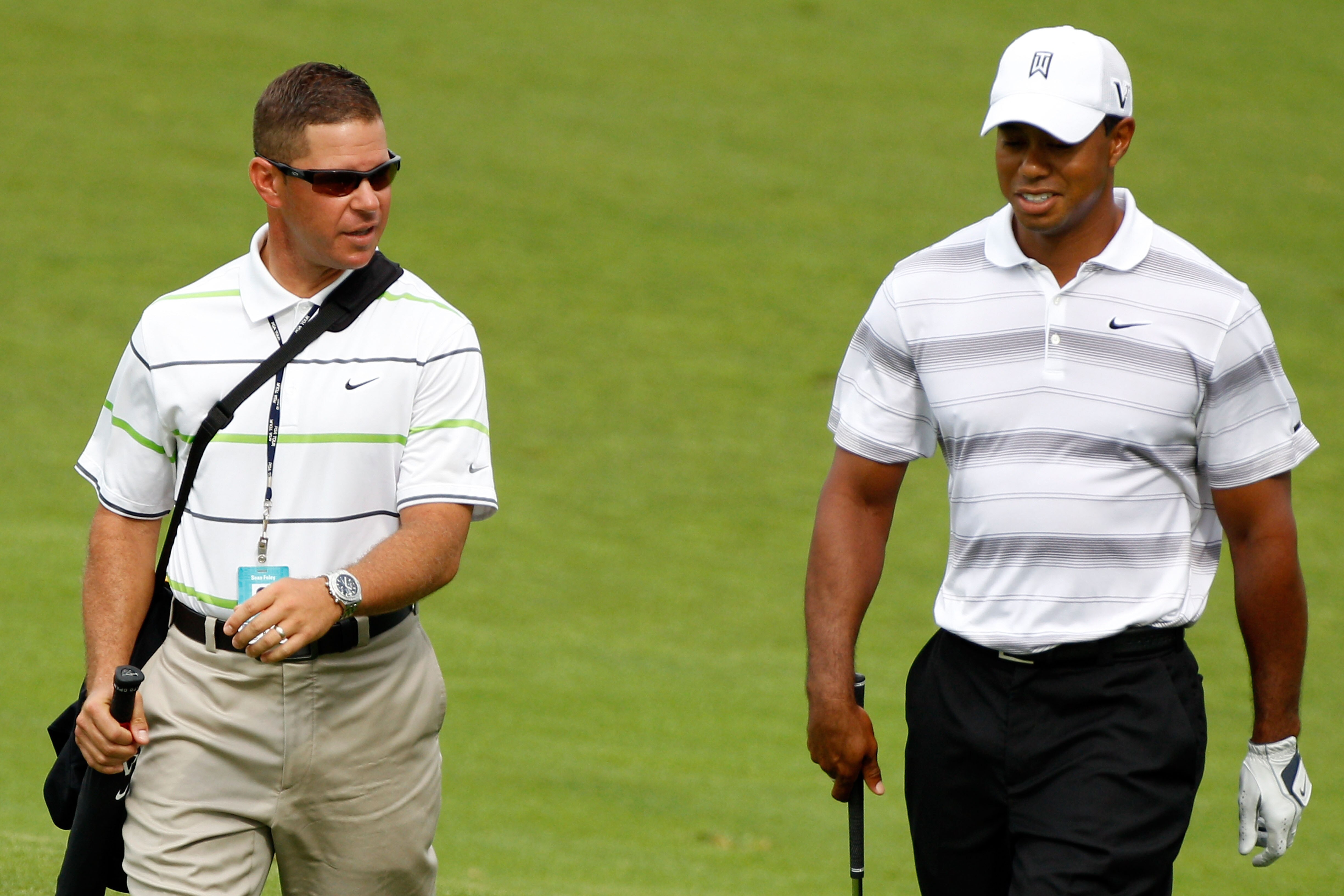 KOHLER, WI - AUGUST 11:  Tiger Woods (R) walks with golf instructor Sean Foley during a practice round prior to the start of the 92nd PGA Championship on the Straits Course at Whistling Straits on August 11, 2010 in Kohler, Wisconsin.  (Photo by Sam Green