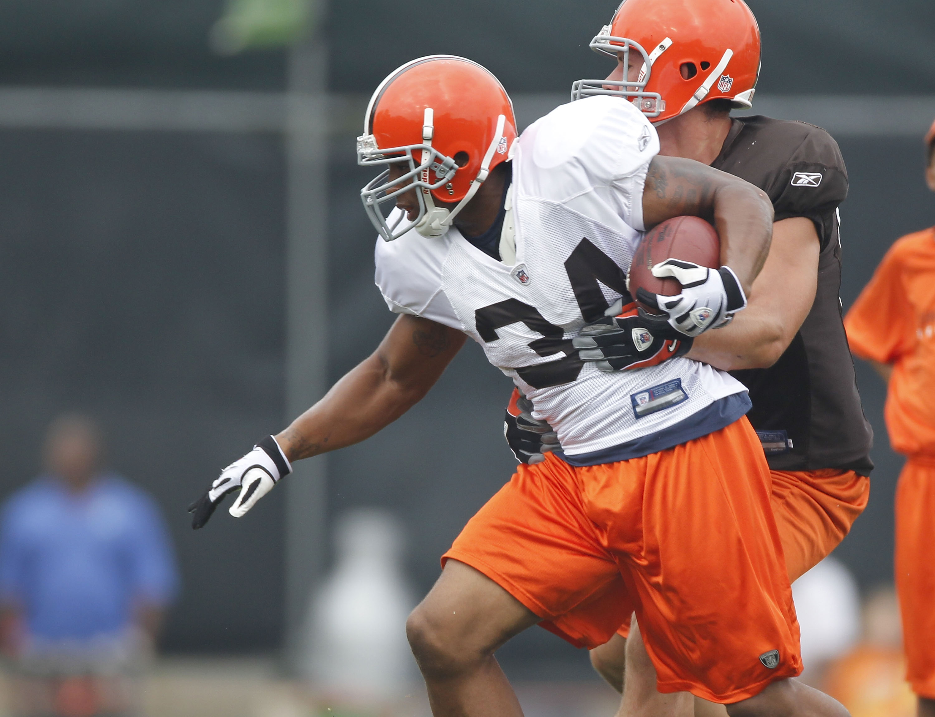 BEREA, OH - AUGUST 04:  Chris Jennings #34 of the Cleveland Browns tries to escape a tackle during training camp at the Cleveland Browns Training and Administrative Complex on August 4, 2010 in Berea, Ohio.  (Photo by Gregory Shamus/Getty Images)