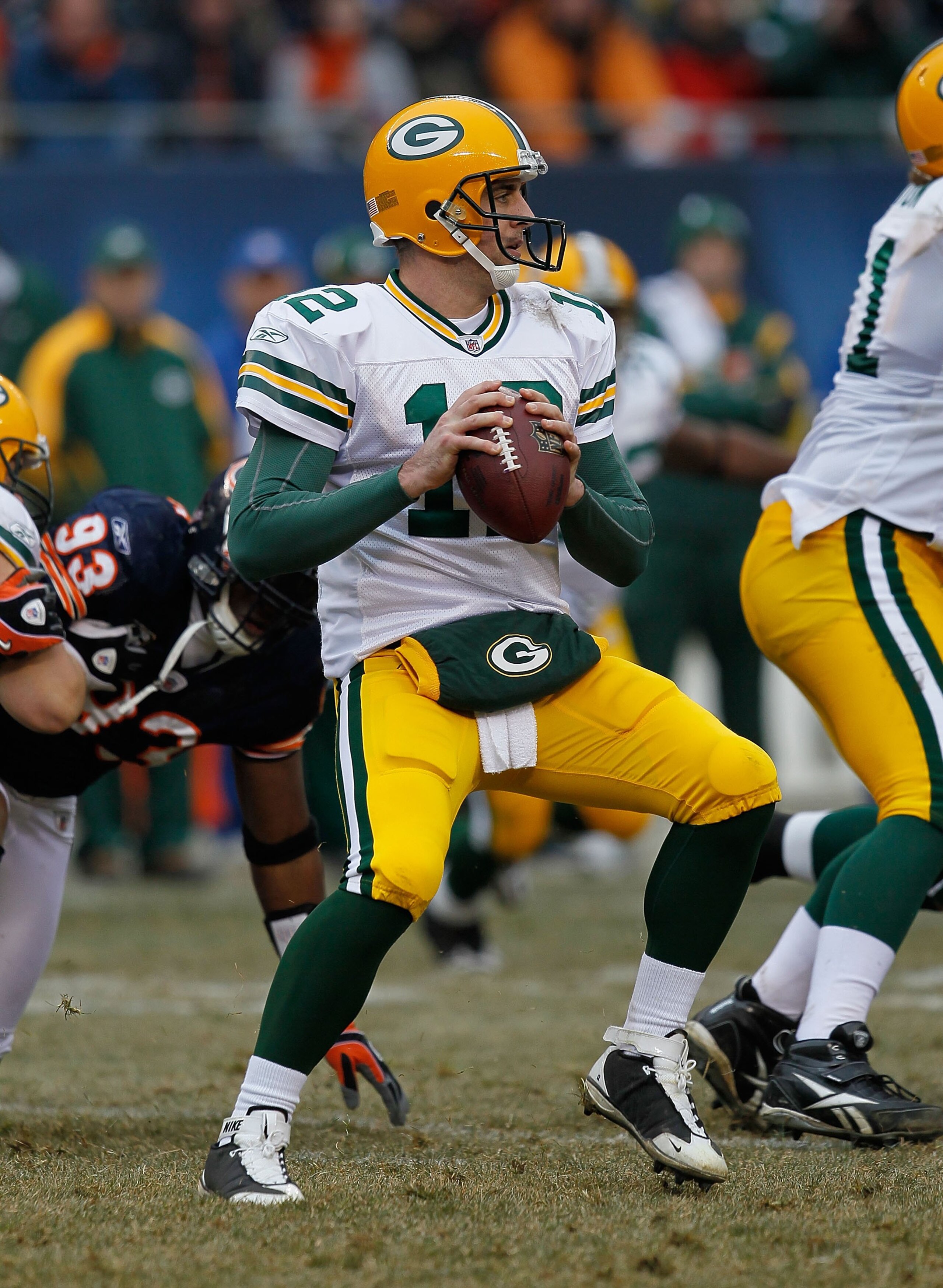 CHICAGO - DECEMBER 13: Aaron Rodgers #12 of the Green Bay Packers looks for a receiver against the Chicago Bears at Soldier Field on December 13, 2009 in Chicago, Illinois. The Packers defeated the Bears 21-14. (Photo by Jonathan Daniel/Getty Images)