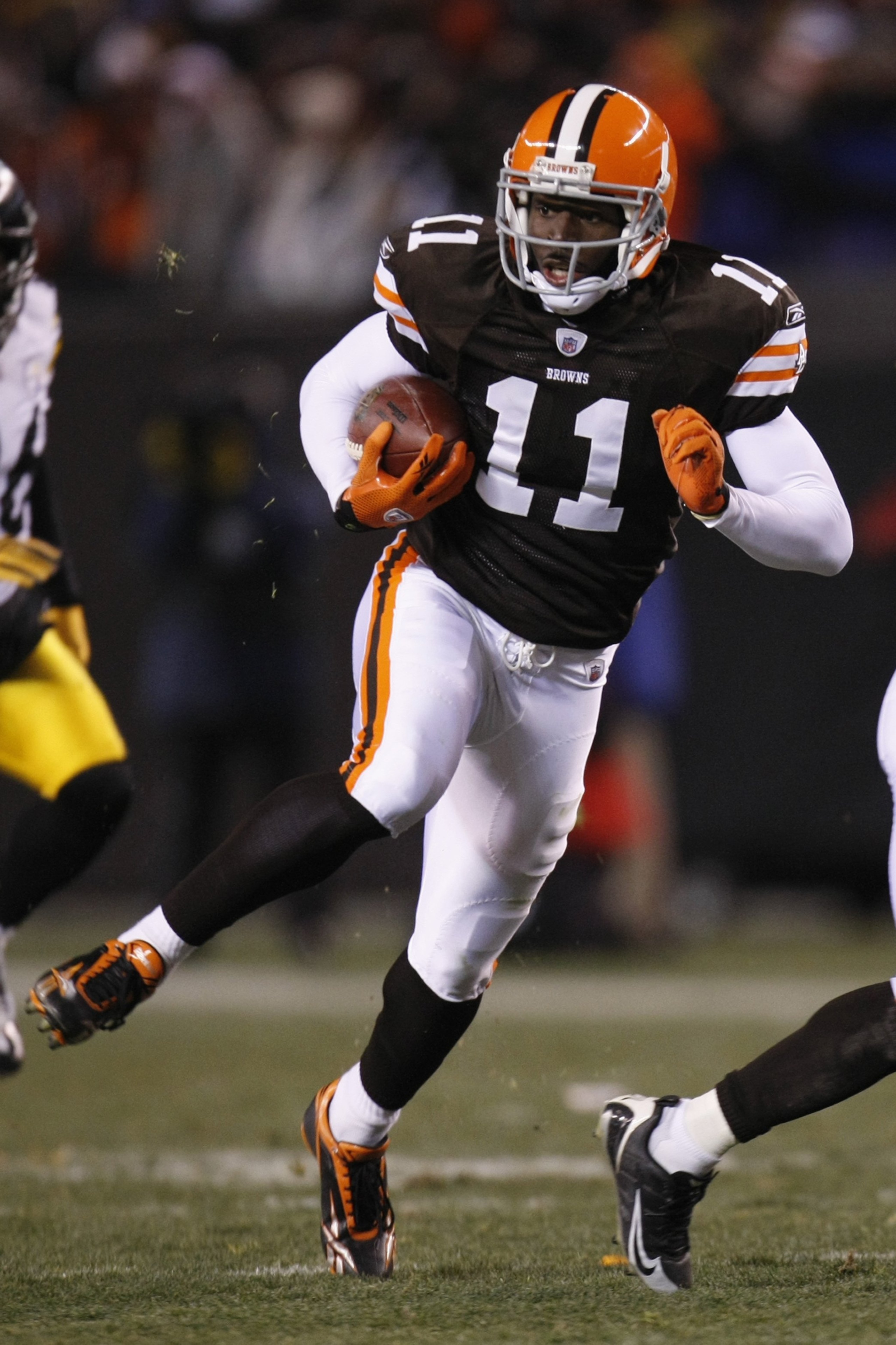CLEVELAND - DECEMBER 10: Mohamed Massaquoi #11 of the Cleveland Browns runs with the ball during the game against the Pittsburgh Steelers on December 10, 2009 at Cleveland Browns Stadium in Cleveland, Ohio. Cleveland won the game 13-6. (Photo by Gregory CLEVELAND - DECEMBER 10: Mohamed Massaquoi #11 of the Cleveland Browns runs with the ball during the game against the Pittsburgh Steelers on December 10, 2009 at Cleveland Browns Stadium in Cleveland, Ohio. Cleveland won the game 13-6. (Photo by Gregory