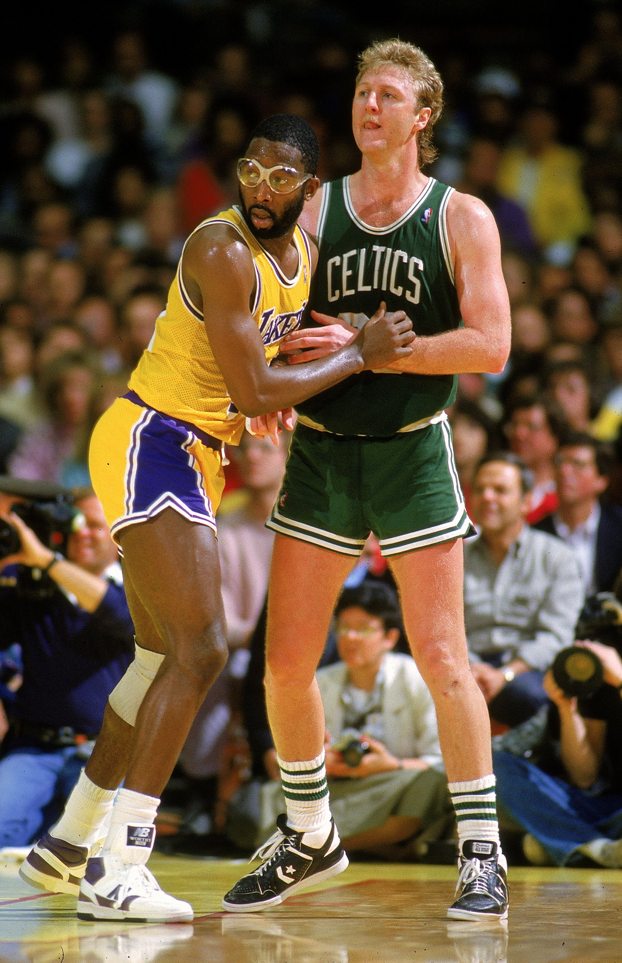 Undated: James Worthy of the Los Angeles Lakers blocks Larry Bird of the Boston Celtics.  Mandatory Credit: Rick Stewart  /Allsport
