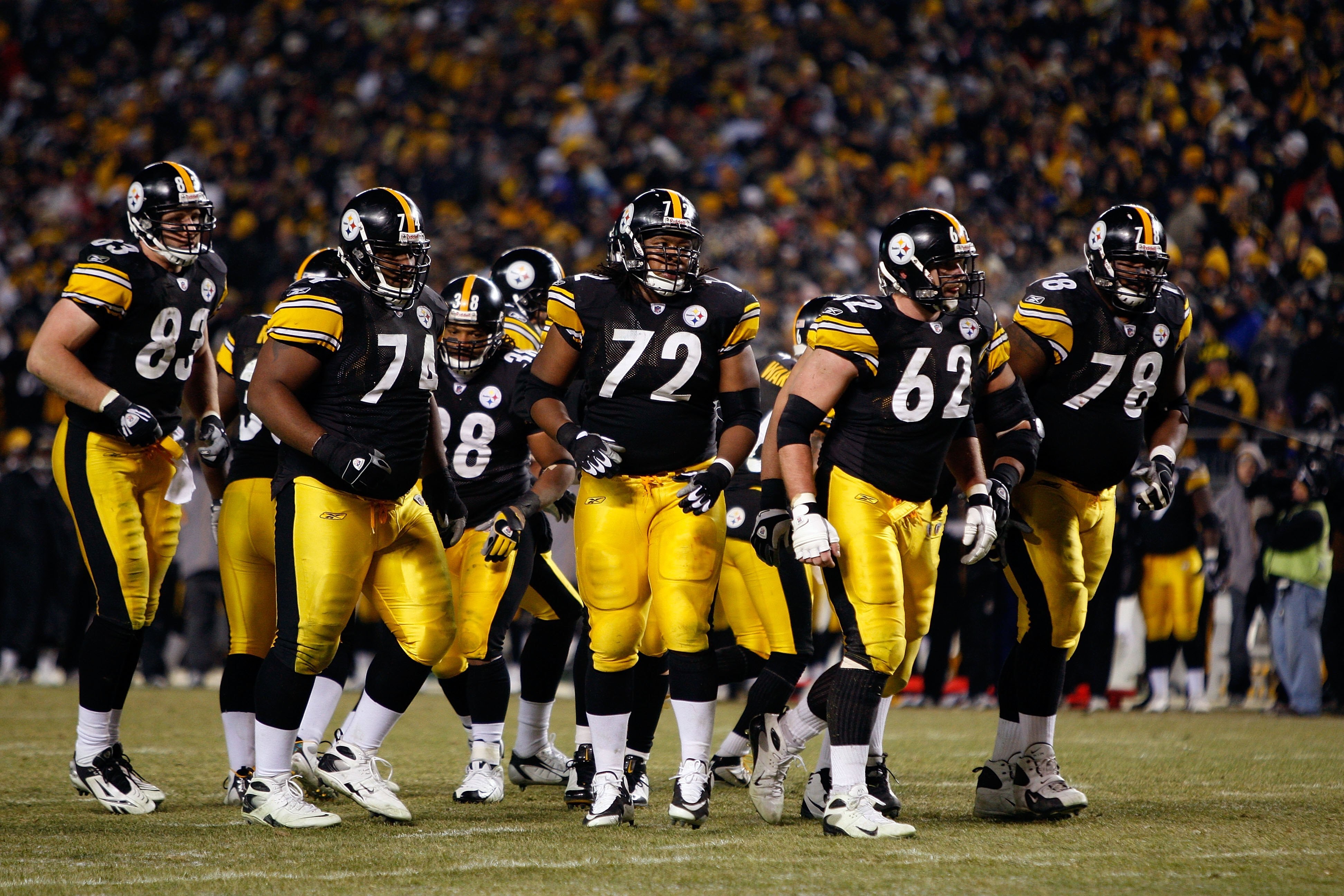PITTSBURGH - JANUARY 11:  (L-R) Heath Miller #83, Willie Colon #74, Carey Davis, #38, Darnell Stapleton #72, Justin Hartwig #62 and Max Starks #78 of the Pittsburgh Steelers break the offensive huddle against the San Diego Chargers during their AFC Divisi
