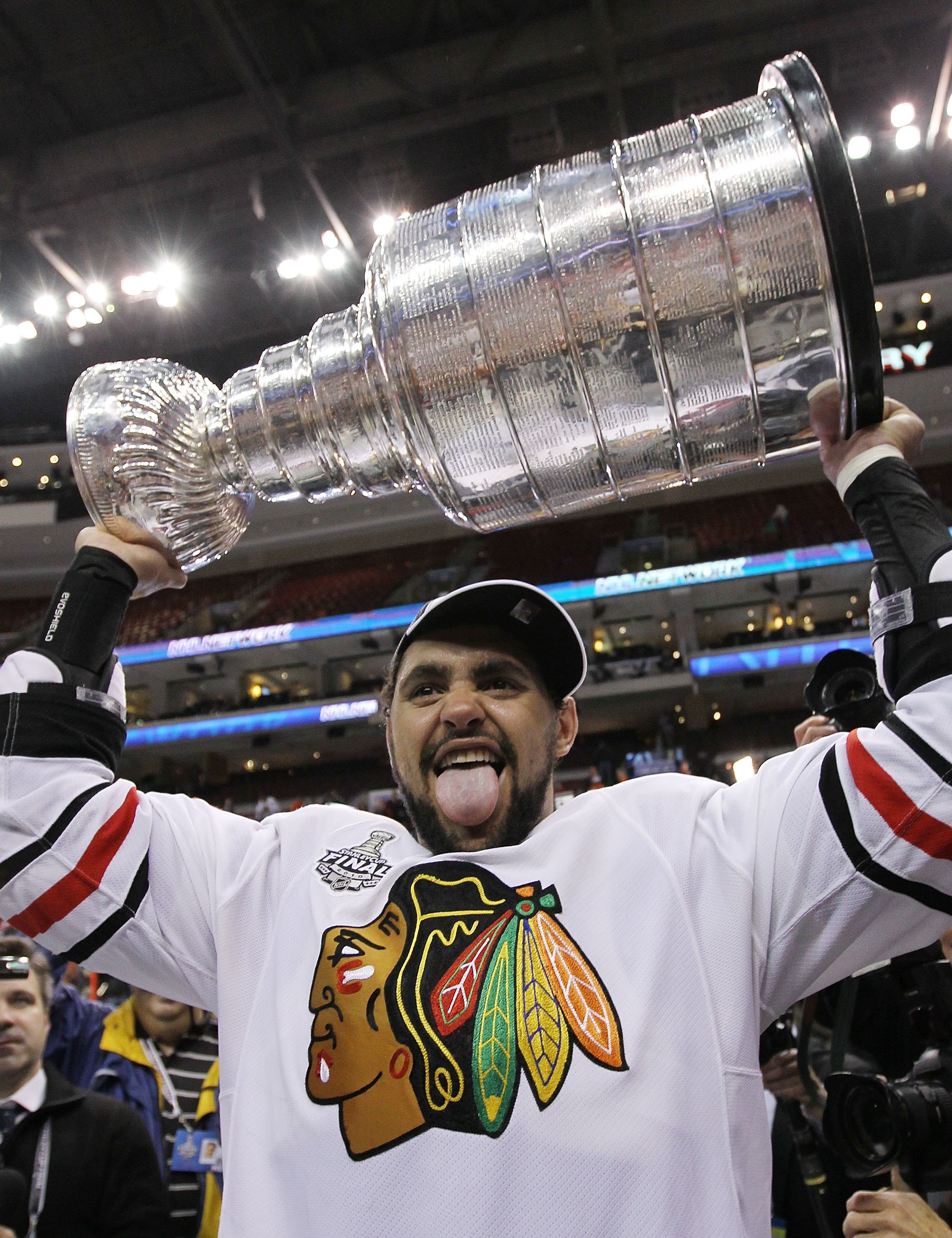PHILADELPHIA - JUNE 09:  Dustin Byfuglien #33 of the Chicago Blackhawks hoists the Stanley Cup after the Blackhawks defeated the Philadelphia Flyers 4-3 in overtime to win the Stanley Cup in Game Six of the 2010 NHL Stanley Cup Final at the Wachovia Cente
