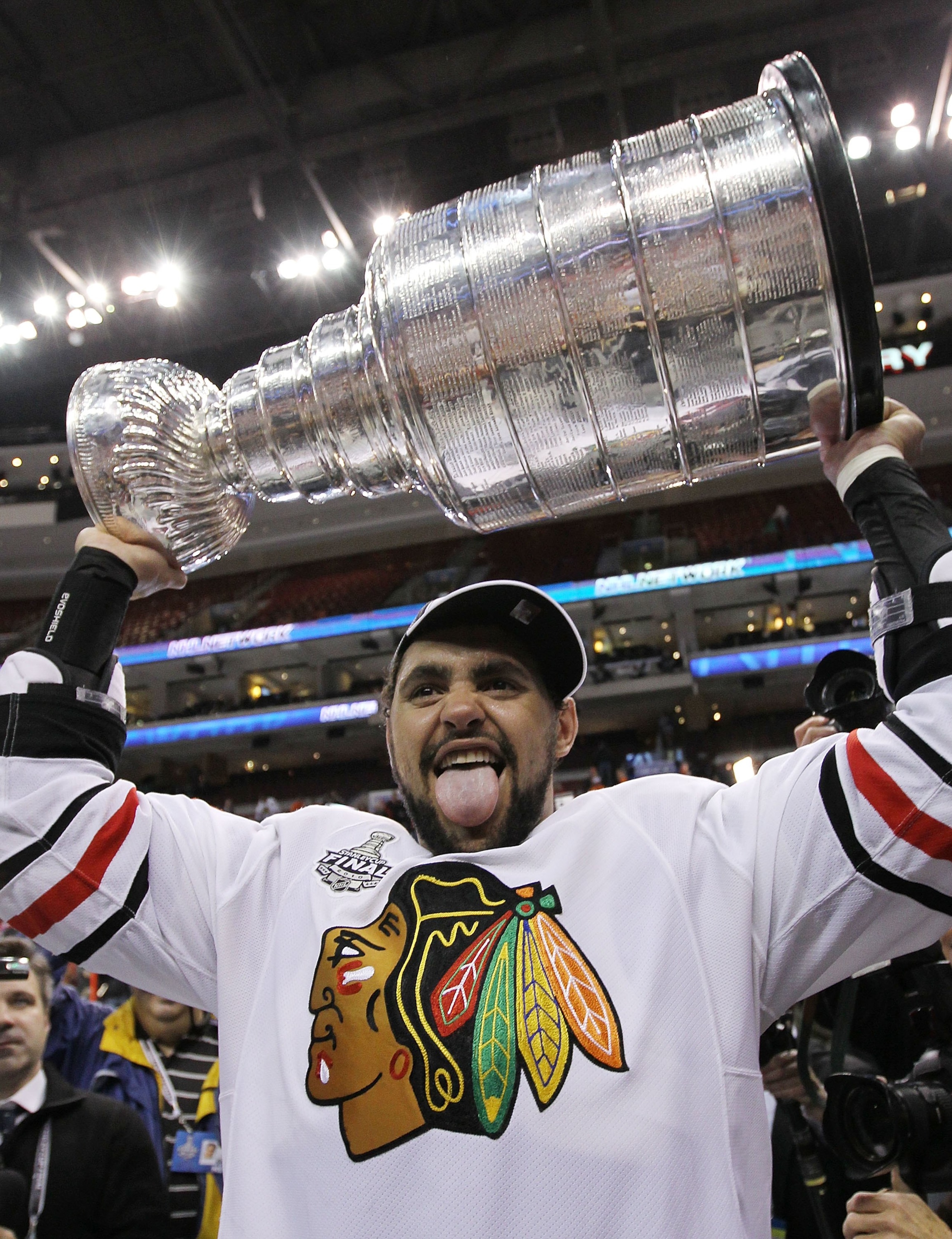PHILADELPHIA - JUNE 09:  Dustin Byfuglien #33 of the Chicago Blackhawks hoists the Stanley Cup after the Blackhawks defeated the Philadelphia Flyers 4-3 in overtime to win the Stanley Cup in Game Six of the 2010 NHL Stanley Cup Final at the Wachovia Cente