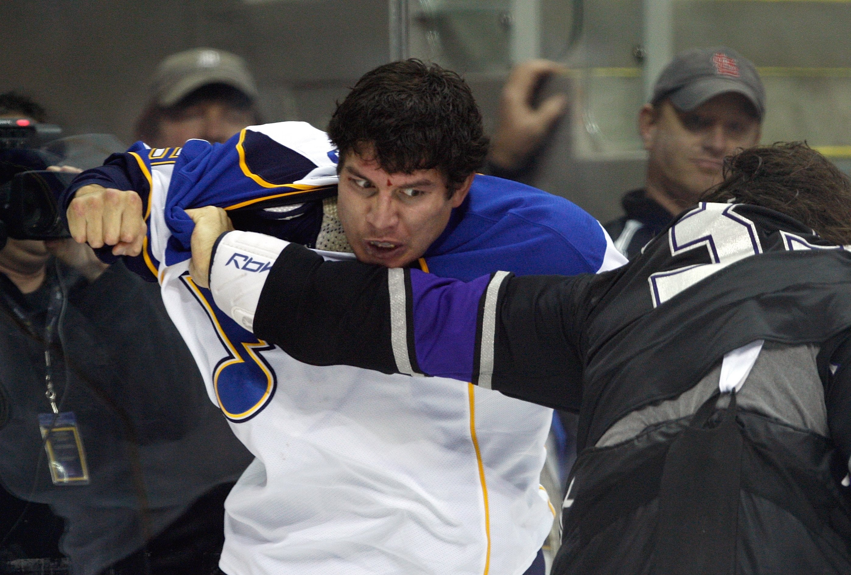 KANSAS CITY, MO - SEPTEMBER 22:  D.J. King #19 of the St. Louis Blues looks to punch Kevin Westgarth #33 of the Los Angeles Kings during a preseason game on September 22, 2008 at the Sprint Center in Kansas City, Missouri. The Kings defeated the Blues 2-1