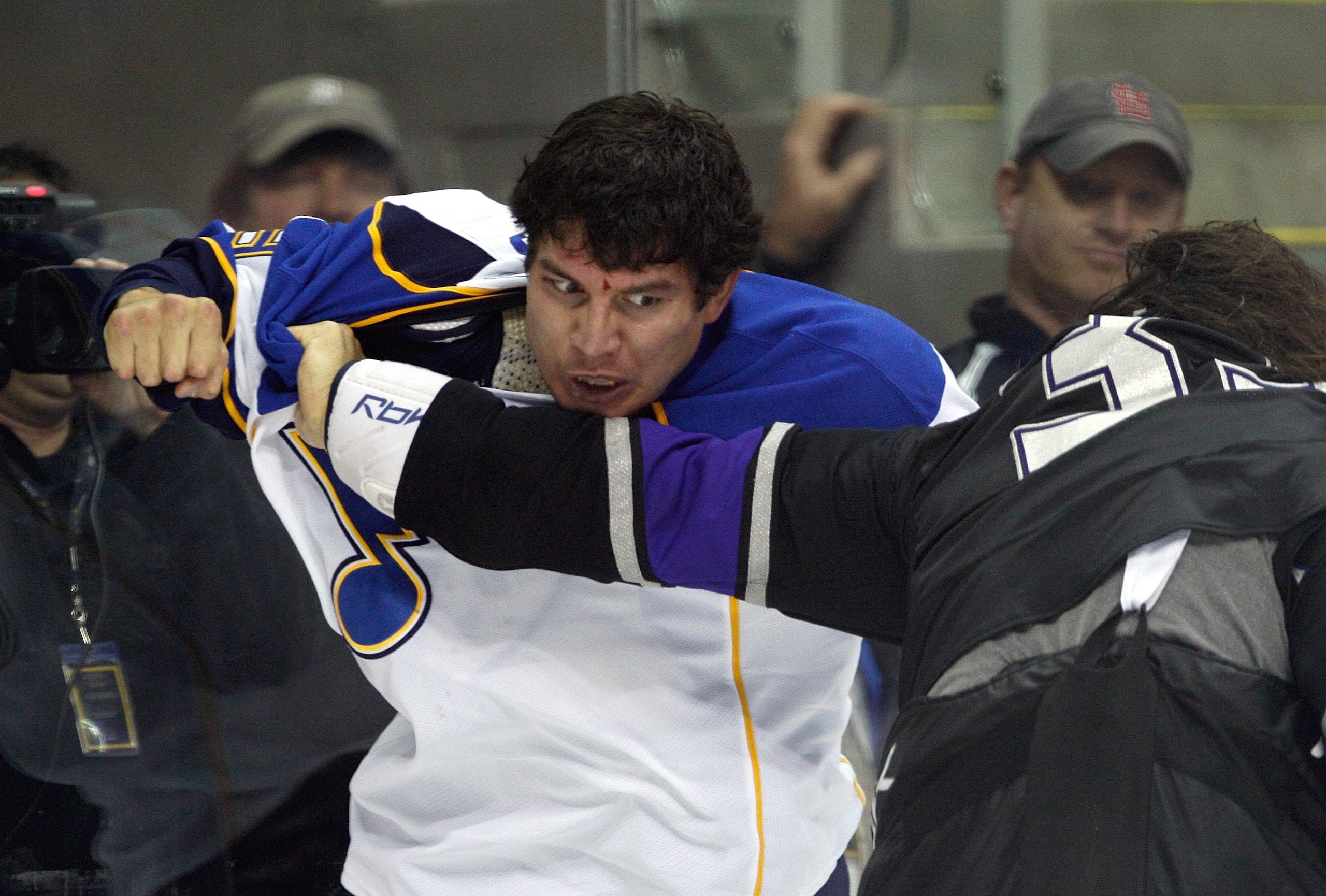 KANSAS CITY, MO - SEPTEMBER 22:  D.J. King #19 of the St. Louis Blues looks to punch Kevin Westgarth #33 of the Los Angeles Kings during a preseason game on September 22, 2008 at the Sprint Center in Kansas City, Missouri. The Kings defeated the Blues 2-1