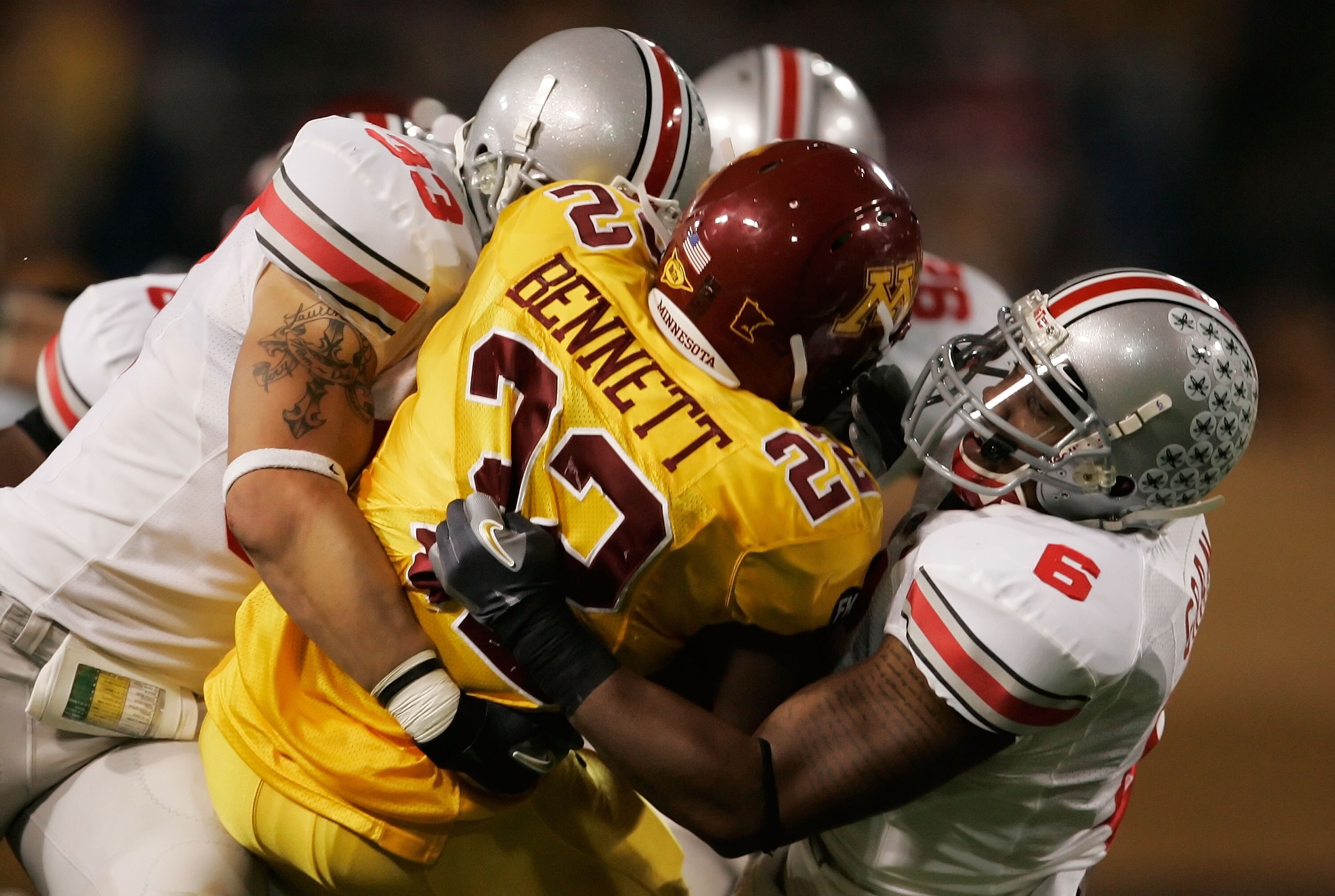 MINNEAPOLIS, MN - SEPTEMBER 29:  Larry Grant #6 and James Laurinaitis #33 of the Ohio State Buckeyes team up to tackle Duane Bennett #22 of the Minnesota Golden Gophers in the third quarter at the Metrodome on September 29, 2007 in Minneapolis, Minnesota.