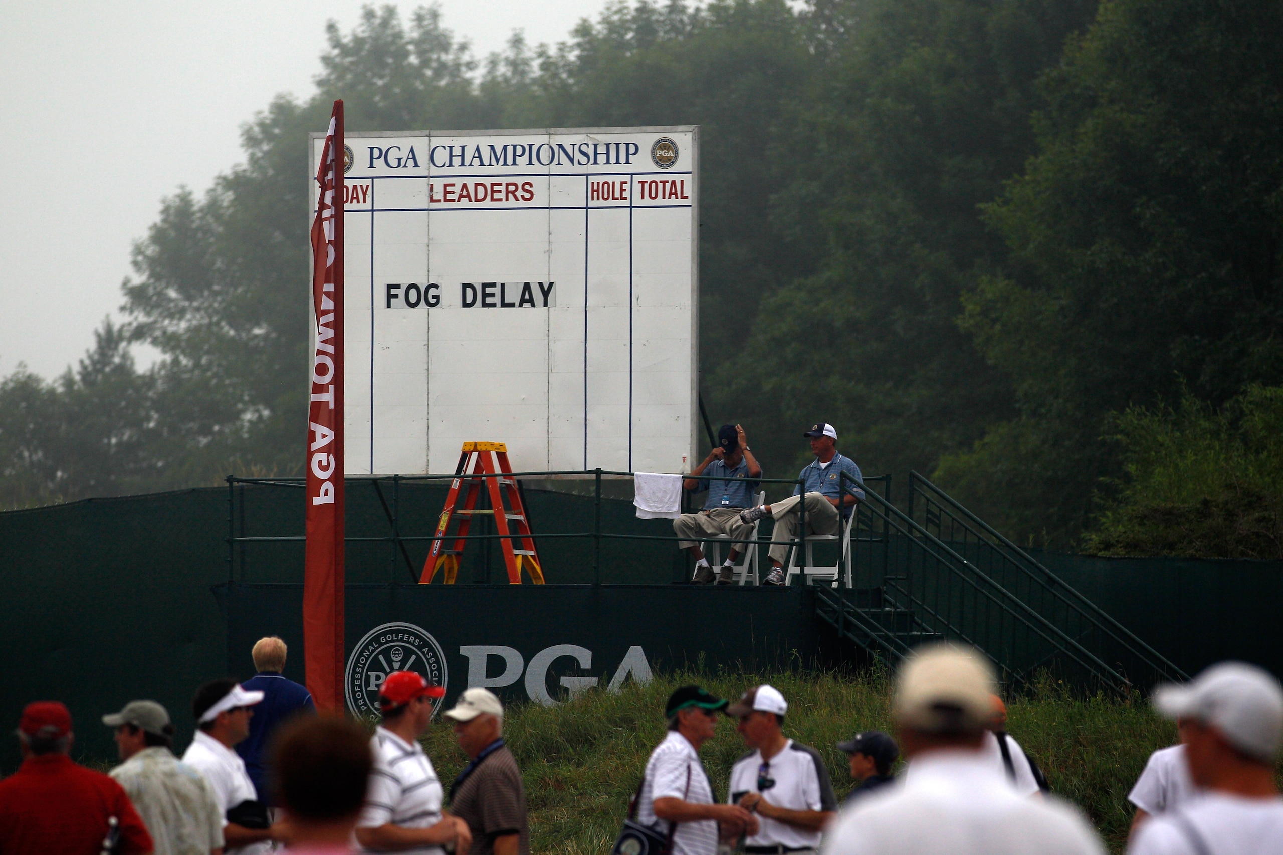 KOHLER, WI - AUGUST 13:  Fans wait out a fog delay prior to the start of the continuation of the first round of the 92nd PGA Championship on the Straits Course at Whistling Straits on August 13, 2010 in Kohler, Wisconsin.  (Photo by Chris Graythen/Getty I