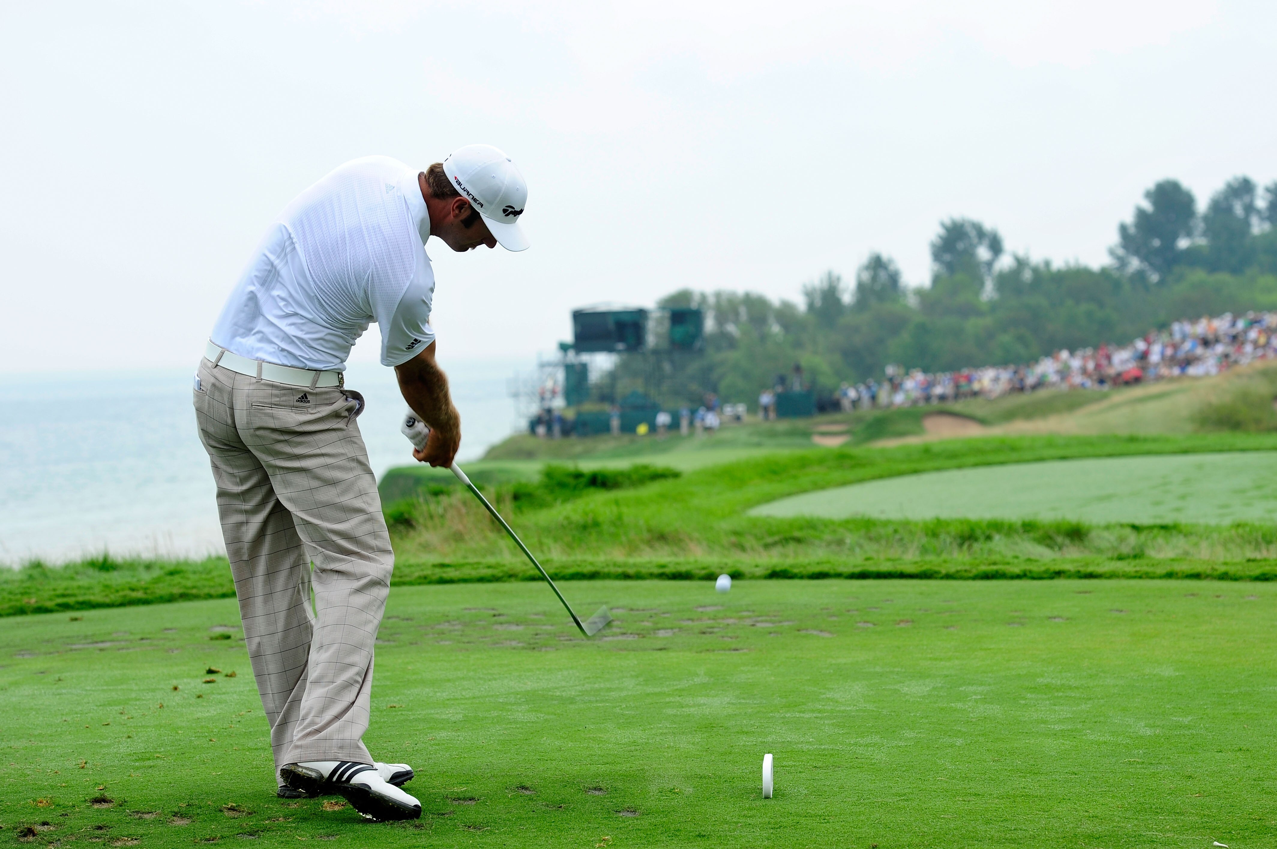 KOHLER, WI - AUGUST 13:  Dustin Johnson hits his tee shot on the 17th hole during the continuation of the first round of the 92nd PGA Championship on the Straits Course at Whistling Straits on August 13, 2010 in Kohler, Wisconsin.  (Photo by Stuart Frankl