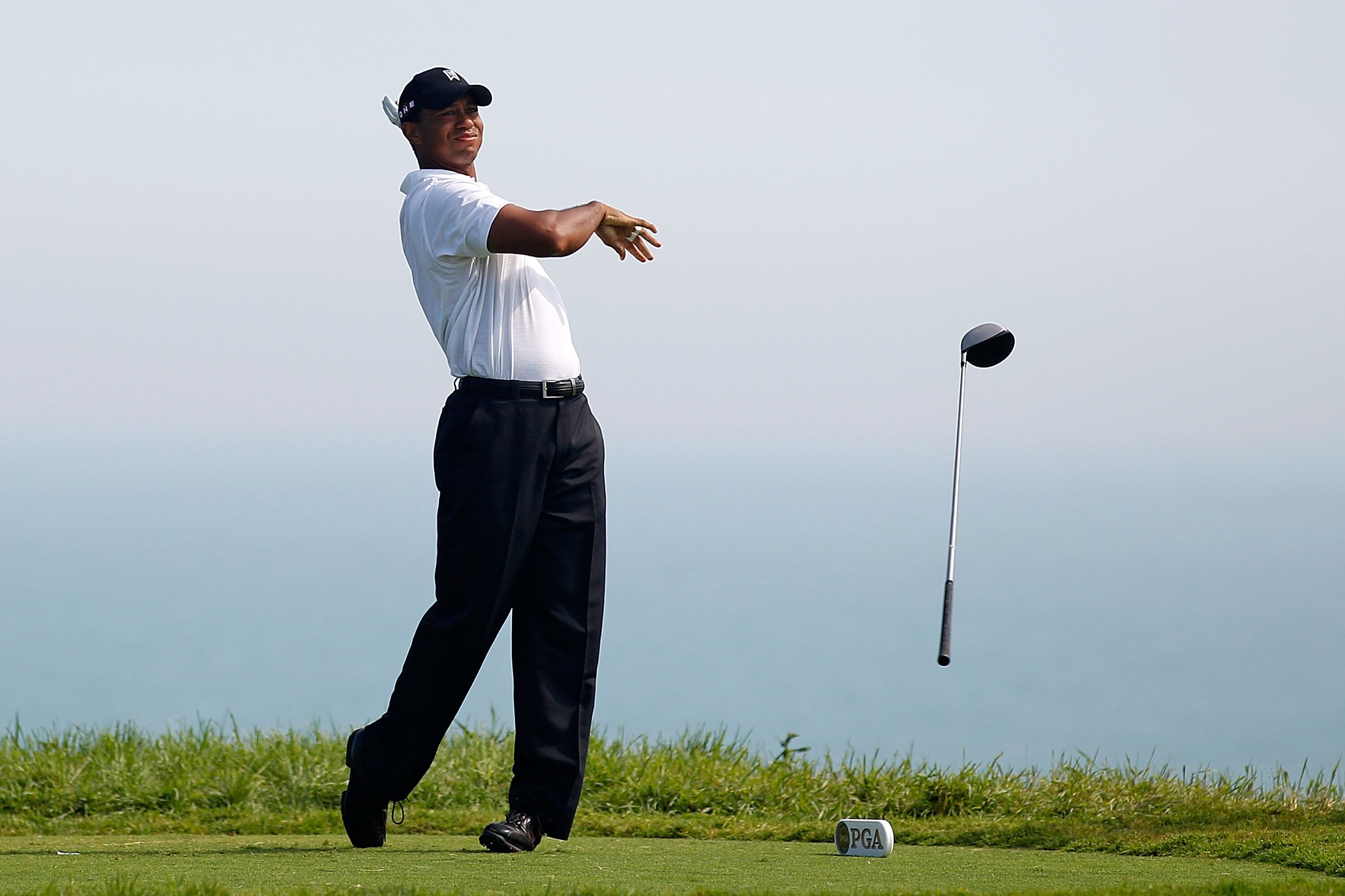 KOHLER, WI - AUGUST 12:  Tiger Woods reacts to his tee shot on the fifth hole during the first round of the 92nd PGA Championship on the Straits Course at Whistling Straits on August 12, 2010 in Kohler, Wisconsin.  (Photo by Chris Graythen/Getty Images)