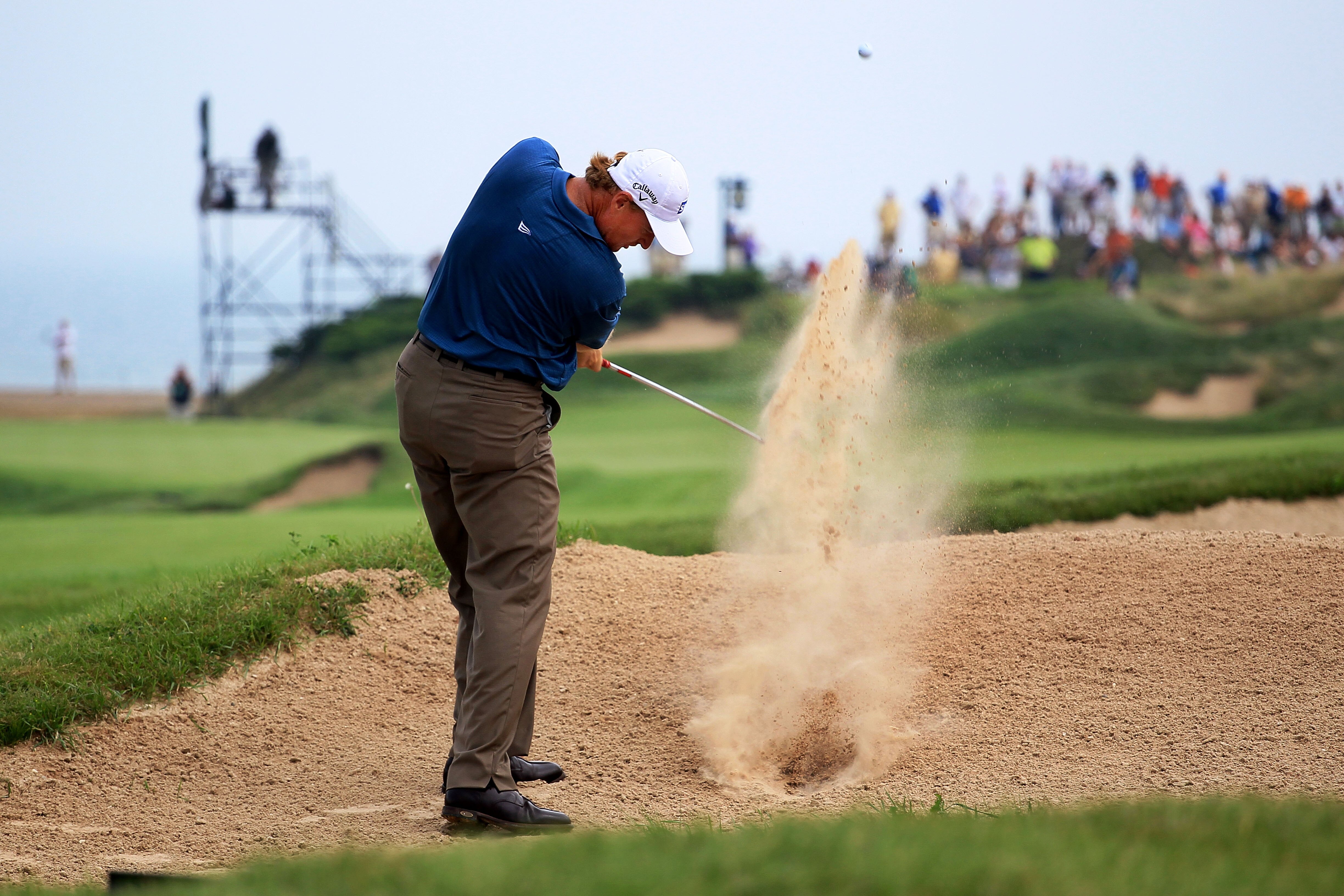 KOHLER, WI - AUGUST 13:  Ernie Els of South Africa plays a bunker shot on the first hole during the second round of the 92nd PGA Championship on the Straits Course at Whistling Straits on August 13, 2010 in Kohler, Wisconsin.  (Photo by Andy Lyons/Getty I