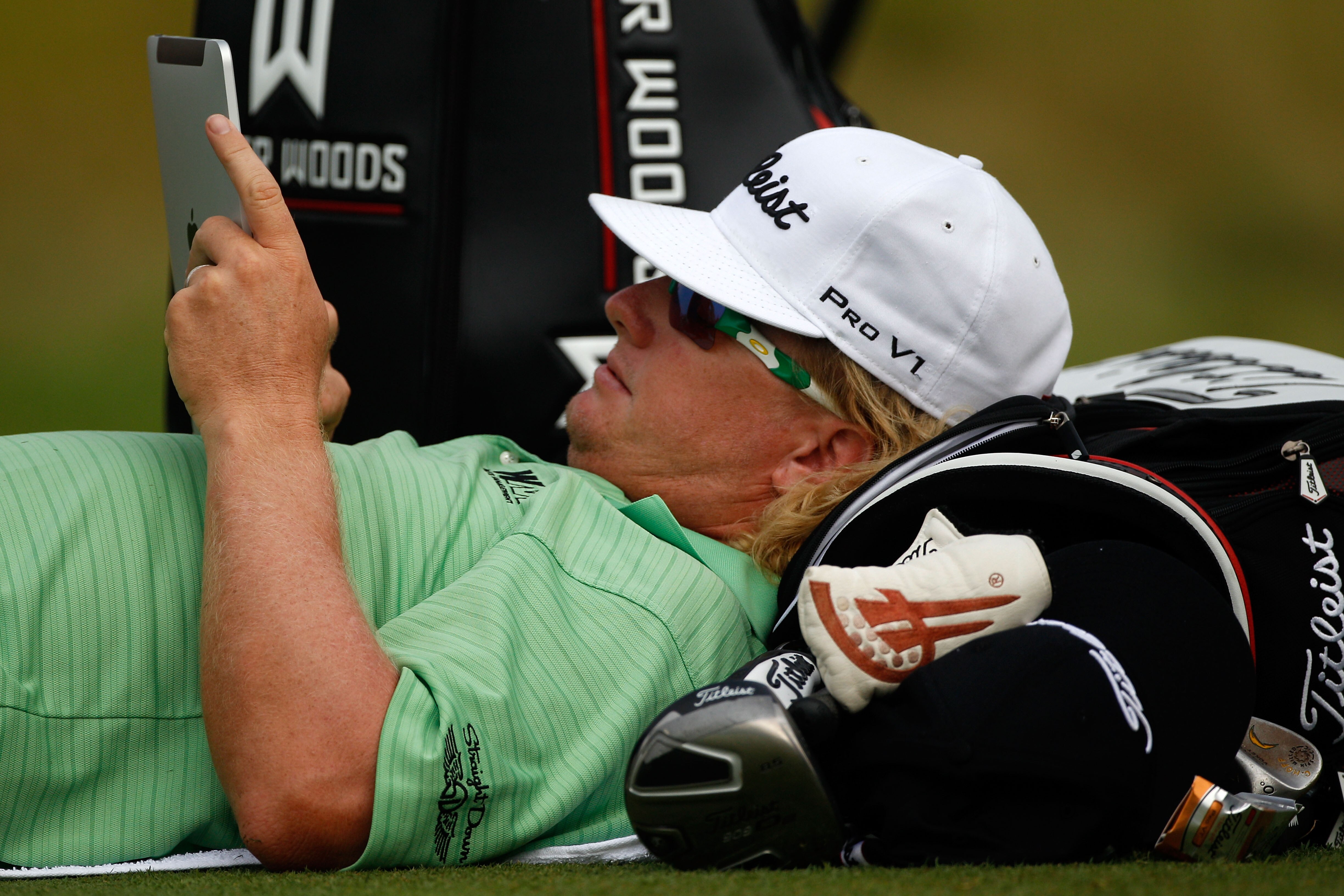 KOHLER, WI - AUGUST 12:  Charley Hoffman uses his iPad during a weather delay prior to the start of the first round of the 92nd PGA Championship on the Straits Course at Whistling Straits on August 12, 2010 in Kohler, Wisconsin.  (Photo by Chris Graythen/