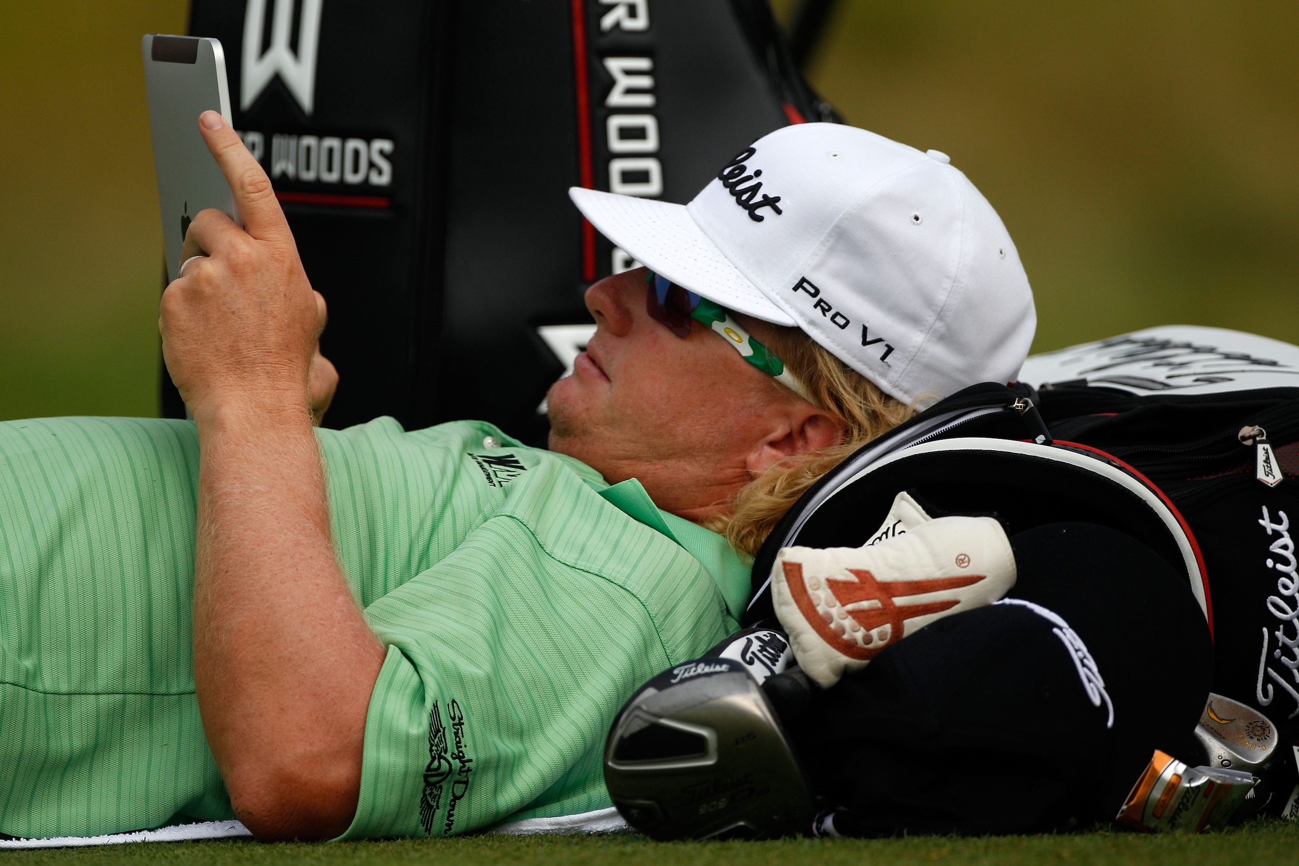 KOHLER, WI - AUGUST 12:  Charley Hoffman uses his iPad during a weather delay prior to the start of the first round of the 92nd PGA Championship on the Straits Course at Whistling Straits on August 12, 2010 in Kohler, Wisconsin.  (Photo by Chris Graythen/