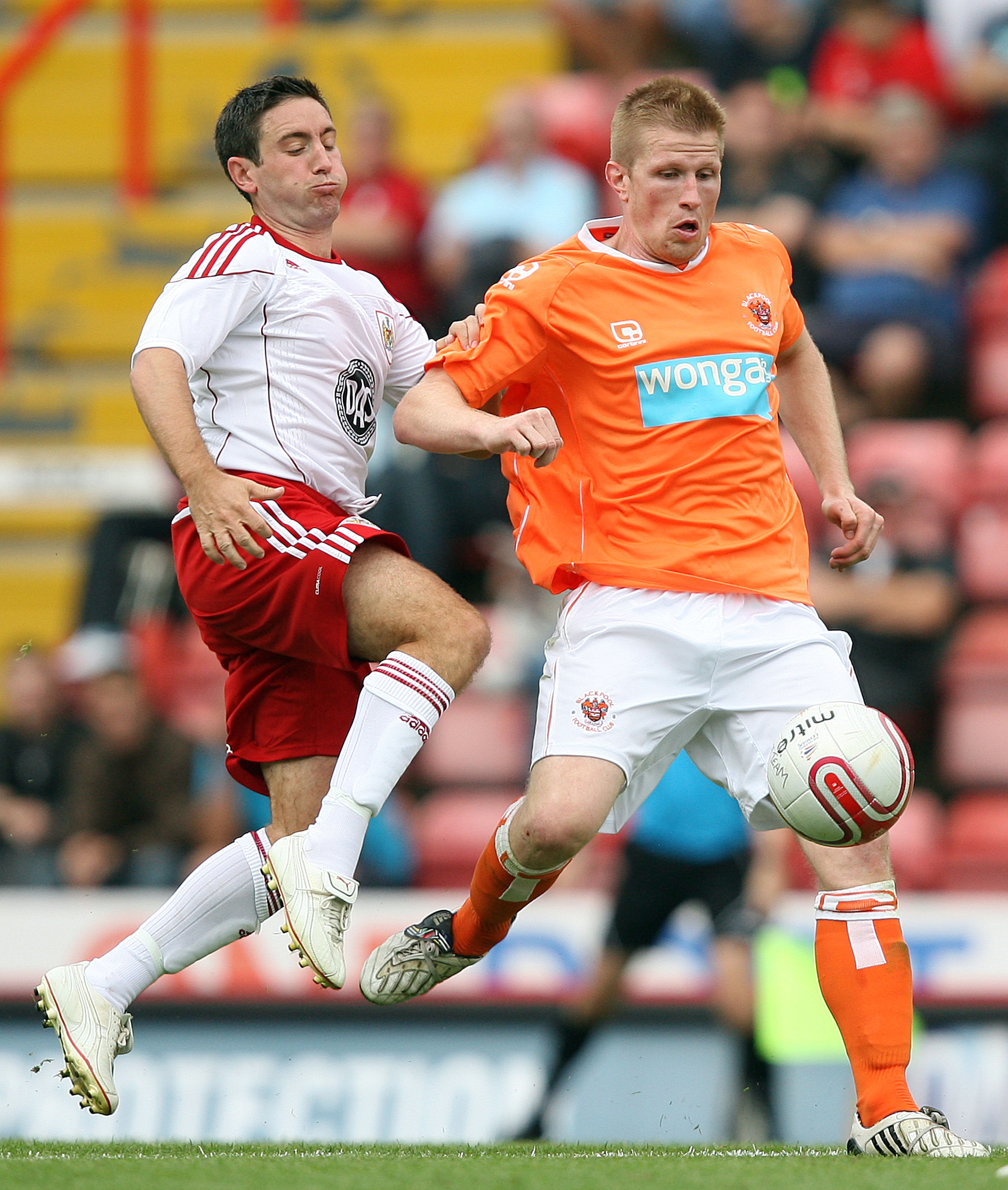 BRISTOL, ENGLAND - JULY 31:  Keith Southern of Blackpool holds off Lee Johnson of Bristol City during the pre-season friendly match between Bristol City and Blackpool at Ashton Gate on July 31, 2010 in Bristol, England.  (Photo by Jan Kruger/Getty Images)