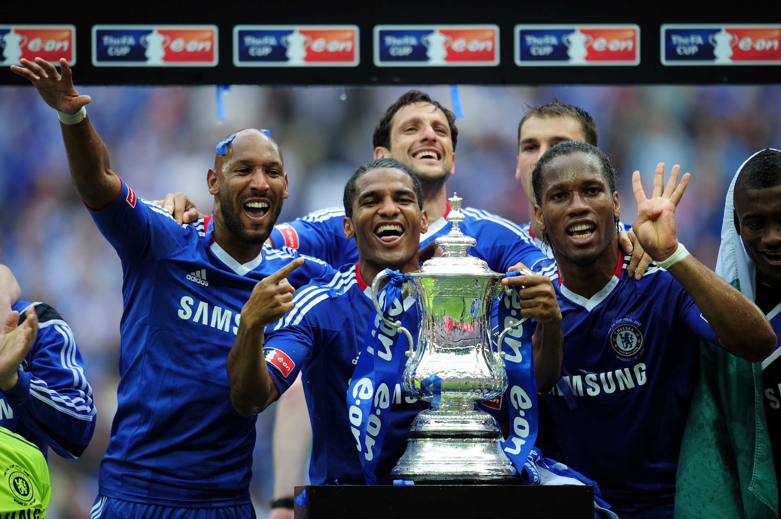 LONDON, ENGLAND - MAY 15:  Nicolas Anelka (L), Didier Drogba (R) and Florent Malouda (C) of Chelsea celebrate winning the FA Cup sponsored by E.ON Final match between Chelsea and Portsmouth at Wembley Stadium on May 15, 2010 in London, England.  (Photo by