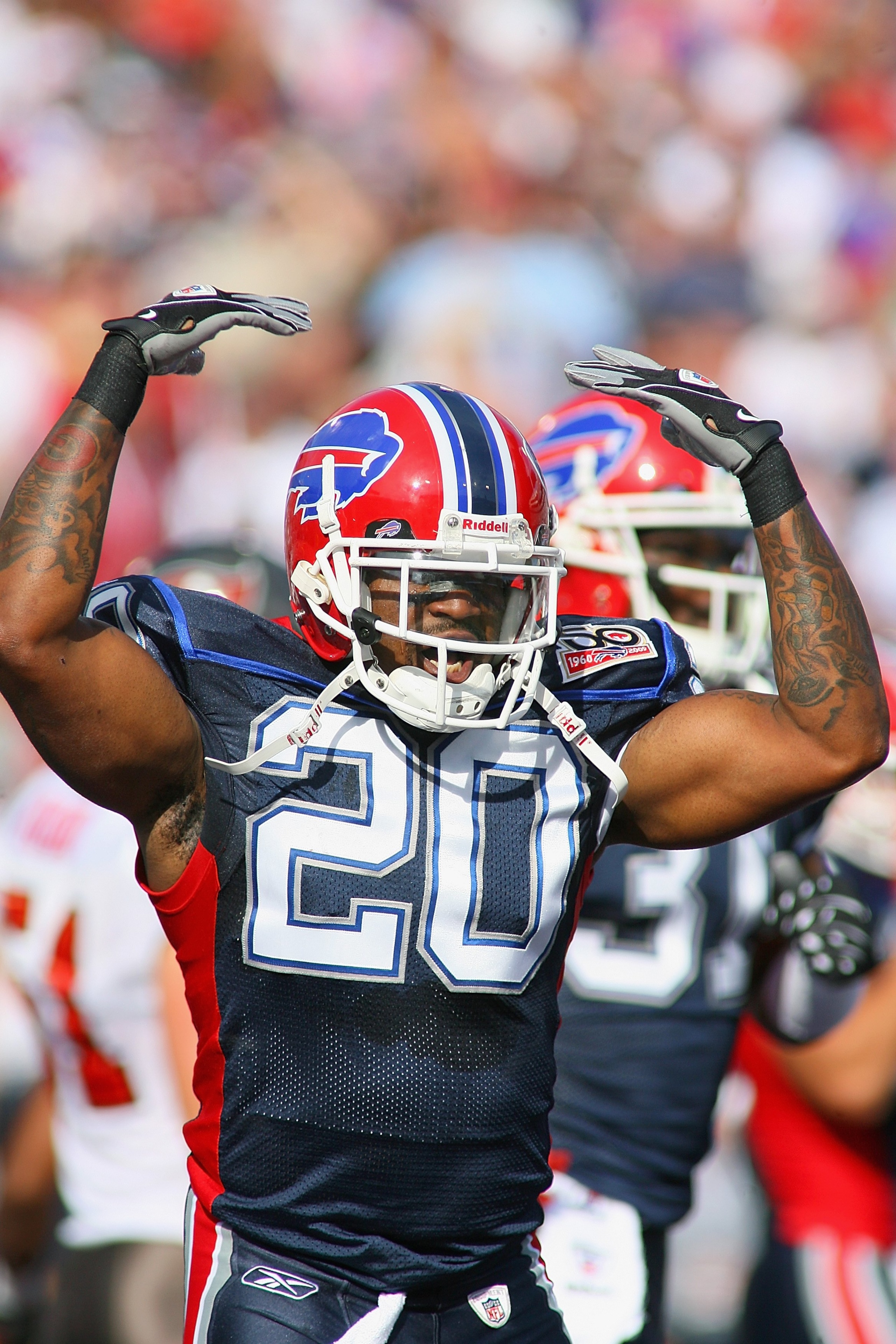 ORCHARD PARK, NY - SEPTEMBER 20:  Safety Donte Whitner #20 of the Buffalo Bills celebrates during the game against the Tampa Bay Buccaneers at Ralph Wilson Stadium on September 20, 2009 in Orchard Park, New York.  The Bills won 33-20.  (Photo by Rick Stew
