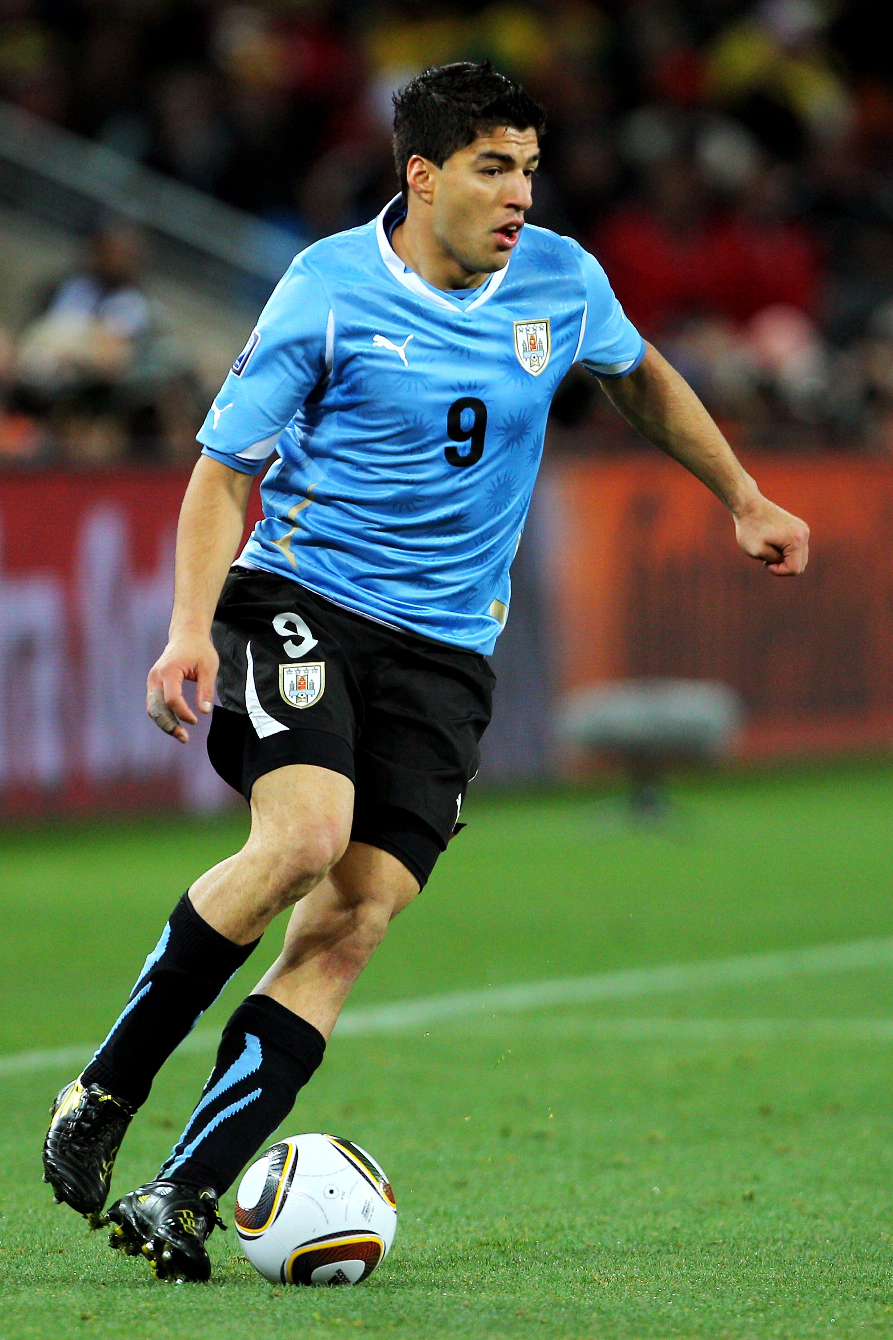 JOHANNESBURG, SOUTH AFRICA - JULY 02:  Luis Suarez of Uruguay controls the ball during the 2010 FIFA World Cup South Africa Quarter Final match between Uruguay and Ghana at the Soccer City stadium on July 2, 2010 in Johannesburg, South Africa.  (Photo by