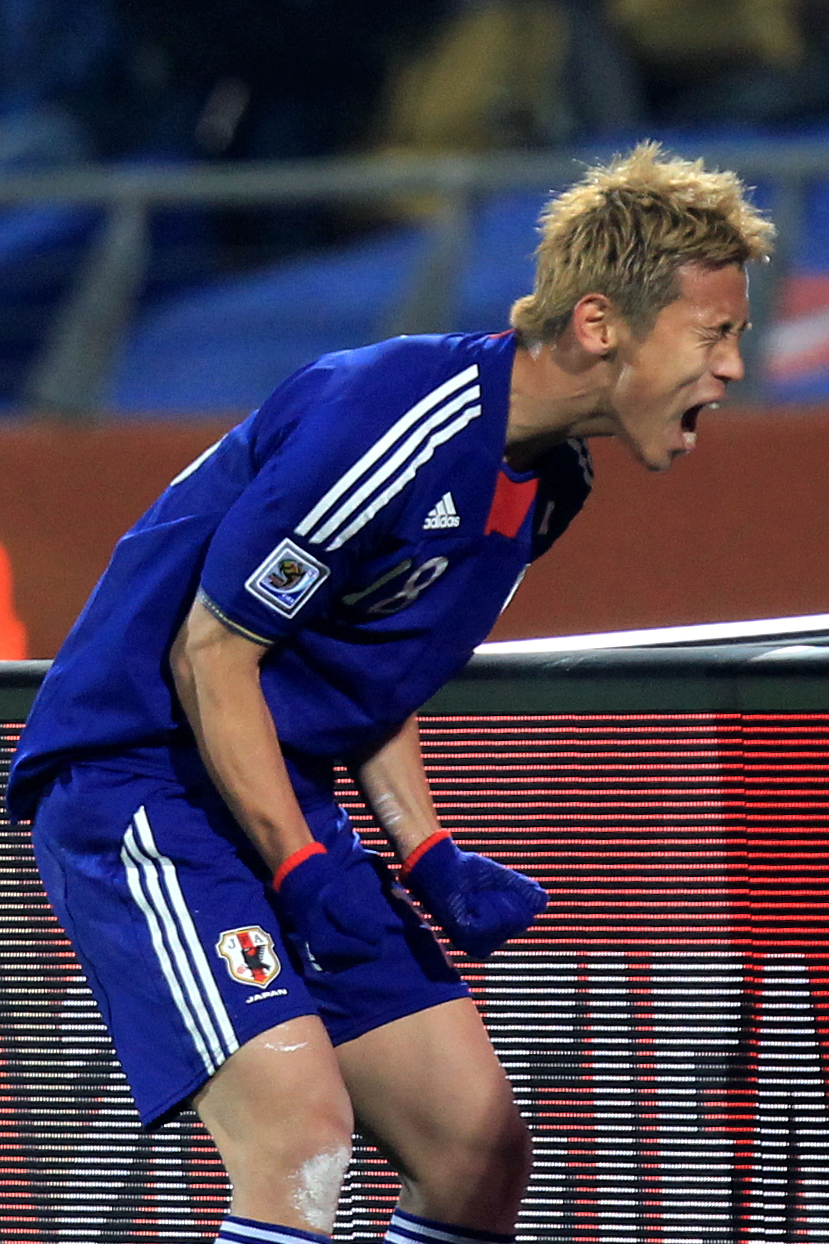 RUSTENBURG, SOUTH AFRICA - JUNE 24:  Keisuke Honda of Japan celebrates scoring the opening goal from a free kick during the 2010 FIFA World Cup South Africa Group E match between Denmark and Japan at the Royal Bafokeng Stadium on June 24, 2010 in Rustenbu