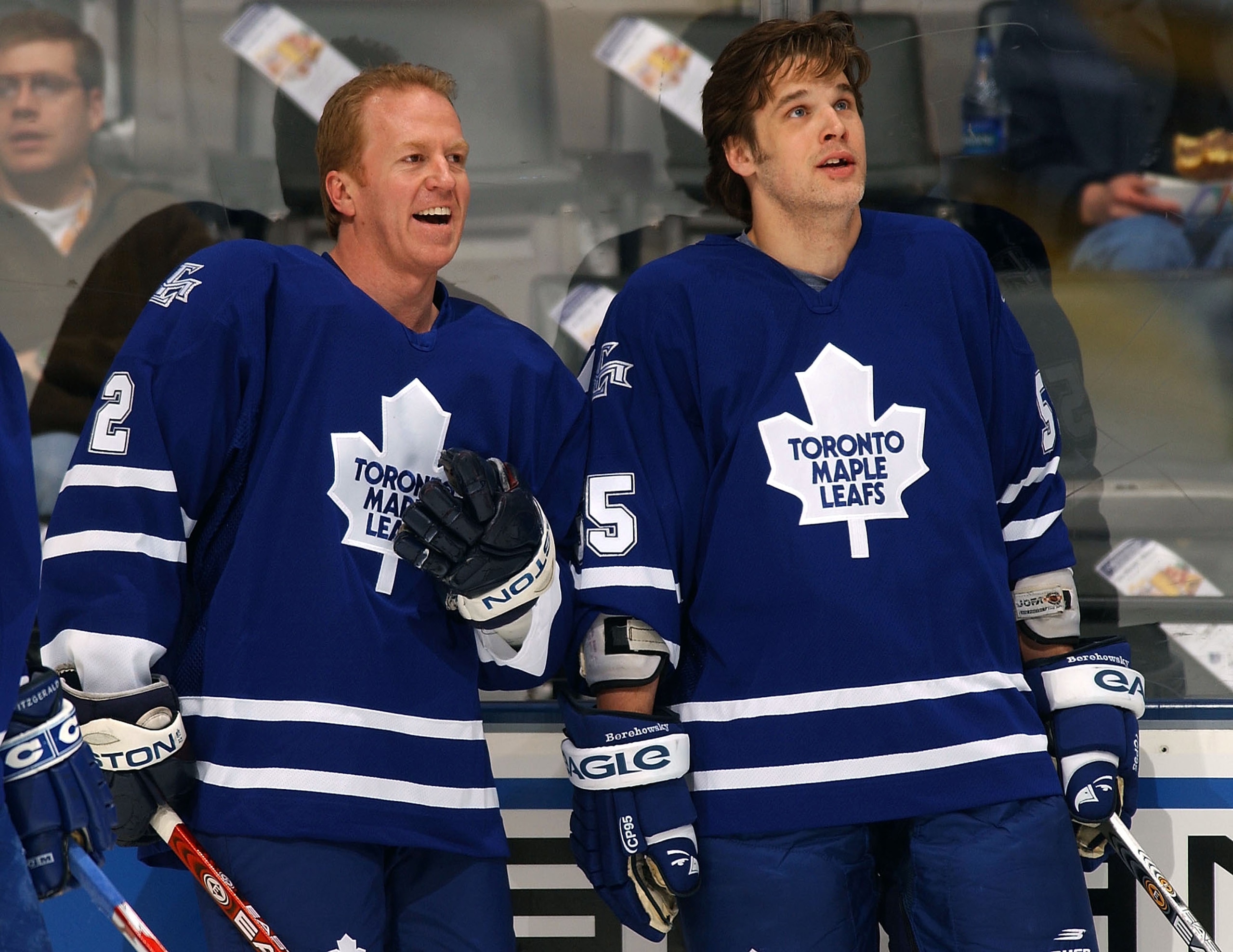 TORONTO - MARCH 4:  Brian Leetch #2 of the Toronto Maple Leafs shares a laugh with teammate Drake Berehowsky #55 during warm up prior to the Leaf's game against the New York Islanders at Air Canada Centre on March 4, 2004 in Toronto, Ontario. It is Leetch