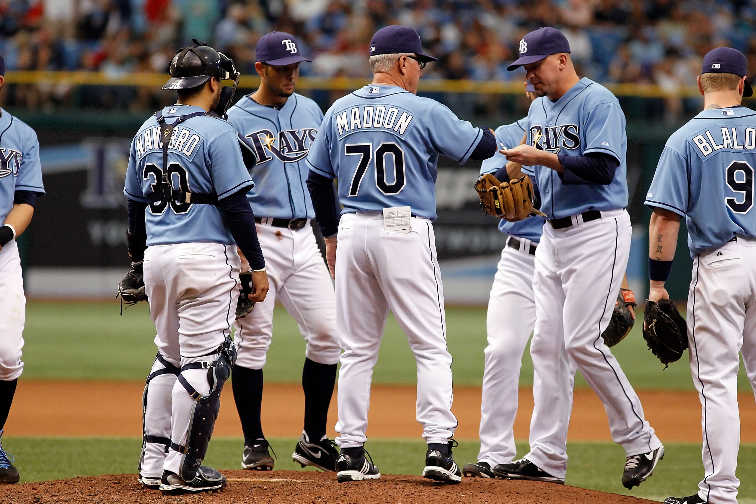 ST. PETERSBURG - MAY 16: Manager Joe Maddon #70 of the Tampa Bay Rays makes a pitching change against the Seattle Mariners during the game at Tropicana Field on May 16, 2010 in St. Petersburg, Florida. (Photo by J. Meric/Getty Images) ST. PETERSBURG - MAY 16: Manager Joe Maddon #70 of the Tampa Bay Rays makes a pitching change against the Seattle Mariners during the game at Tropicana Field on May 16, 2010 in St. Petersburg, Florida. (Photo by J. Meric/Getty Images)