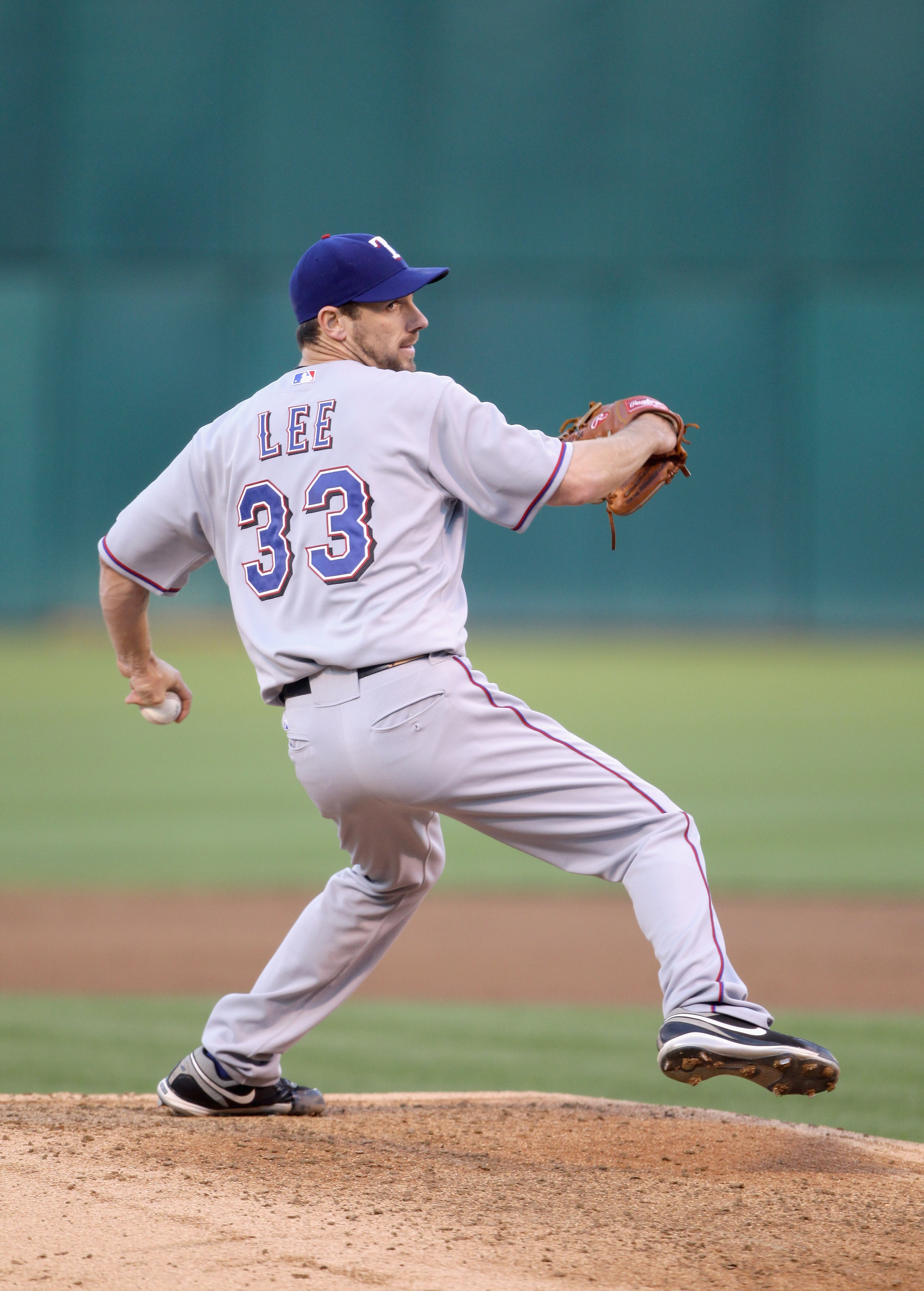 OAKLAND, CA - AUGUST 06:  Cliff Lee #33 of the Texas Rangers pitches against the Oakland Athletics at the Oakland-Alameda County Coliseum on August 6, 2010 in Oakland, California.  (Photo by Ezra Shaw/Getty Images)