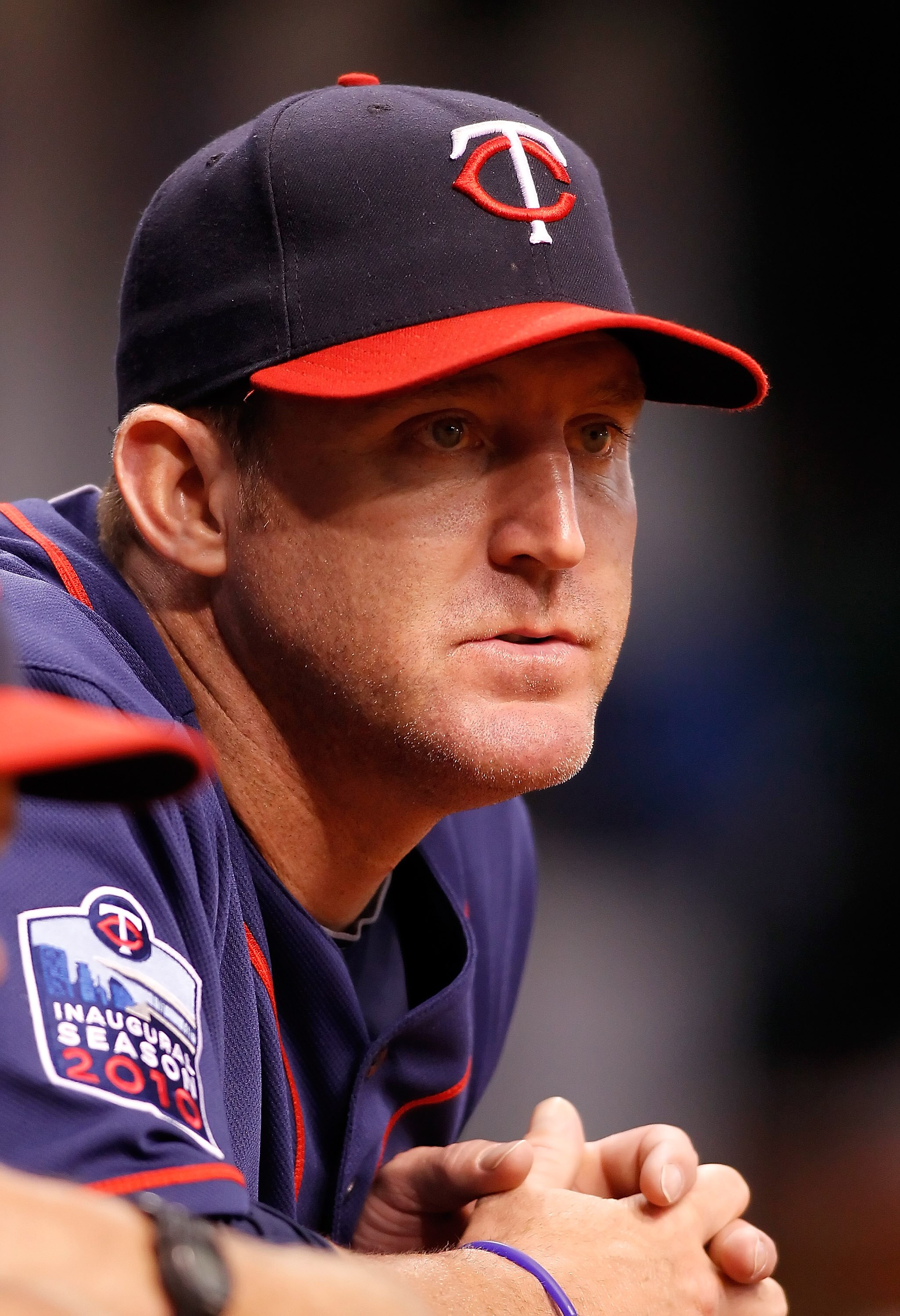 ST. PETERSBURG - AUGUST 04:  Designated hitter Jim Thome #25 of the Minnesota Twins watches his team from the dugout against the Tampa Bay Rays during the game at Tropicana Field on August 4, 2010 in St. Petersburg, Florida.  (Photo by J. Meric/Getty Imag
