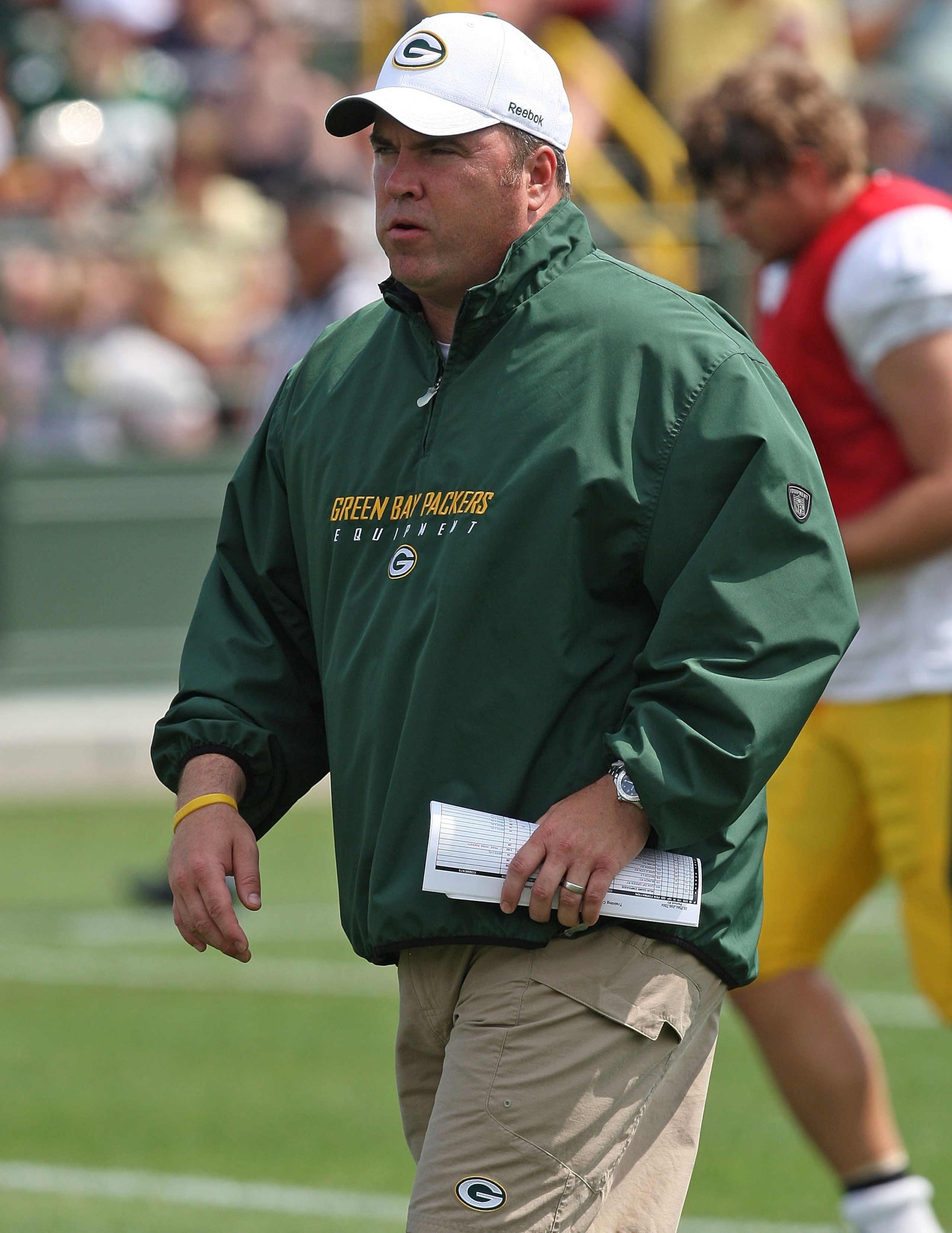 GREEN BAY, WI - AUGUST 03: Head coach Mike McCarthy of the Green Bay Packers watches as his team woirks out during practice at summer training camp on August 3, 2009 at the Ray Nitschke Field in Green Bay, Wisconsin. (Photo by Jonathan Daniel/Getty Images