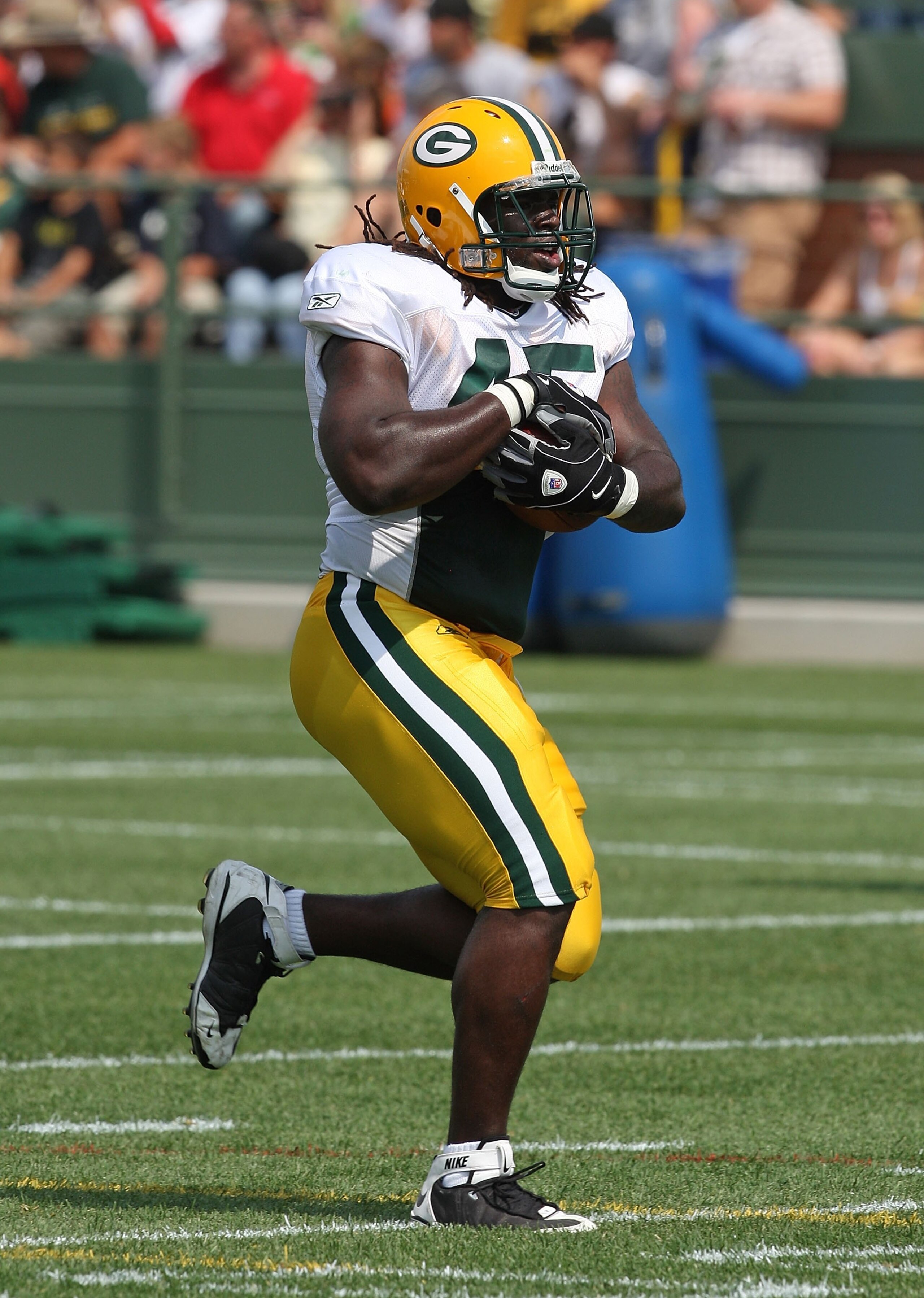 GREEN BAY, WI - AUGUST 03: Quinn Johnson #45 of the Green Bay Packers runs with the ball during practice at summer training camp on August 3, 2009 at the Ray Nitschke Field in Green Bay, Wisconsin. (Photo by Jonathan Daniel/Getty Images)