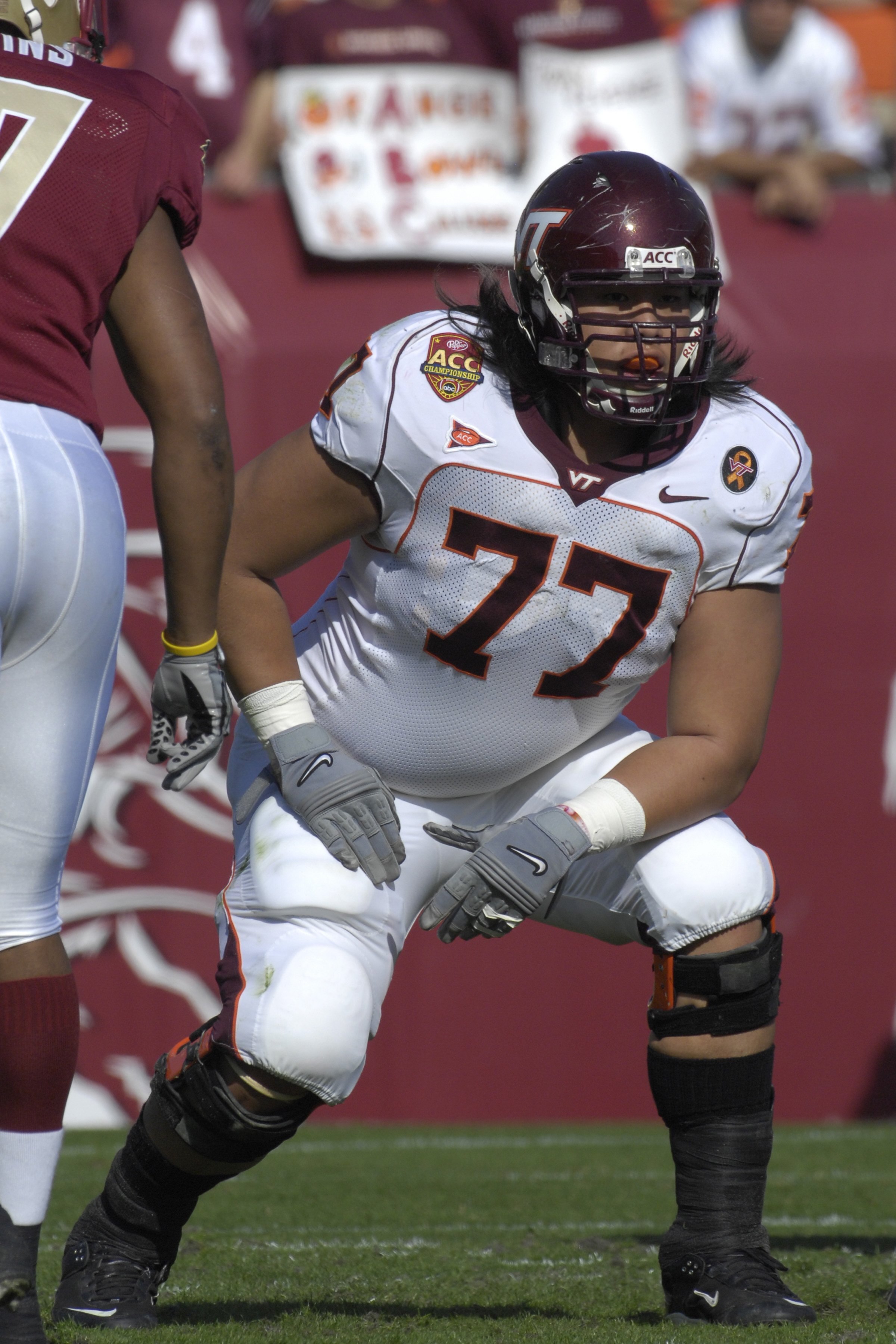 JACKSONVILLE, FL - DECEMBER 1: Tackle Ed Wang #77 of the Virginia Tech Hokies sets to block against the Boston College Eagles in the ACC Championship Game at Jacksonville Municipal Stadium on December 1, 2007 in Jacksonville, Florida.  The Hokies won the 