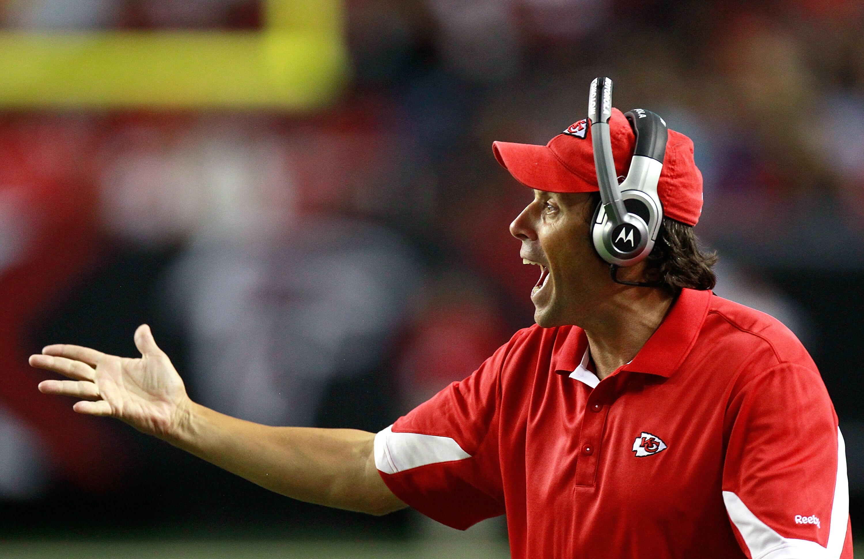 ATLANTA - AUGUST 13:  Head coach Toddy Haley of the Kansas City Chiefs questions a call against the Atlanta Falcons at Georgia Dome on August 13, 2010 in Atlanta, Georgia.  (Photo by Kevin C. Cox/Getty Images)