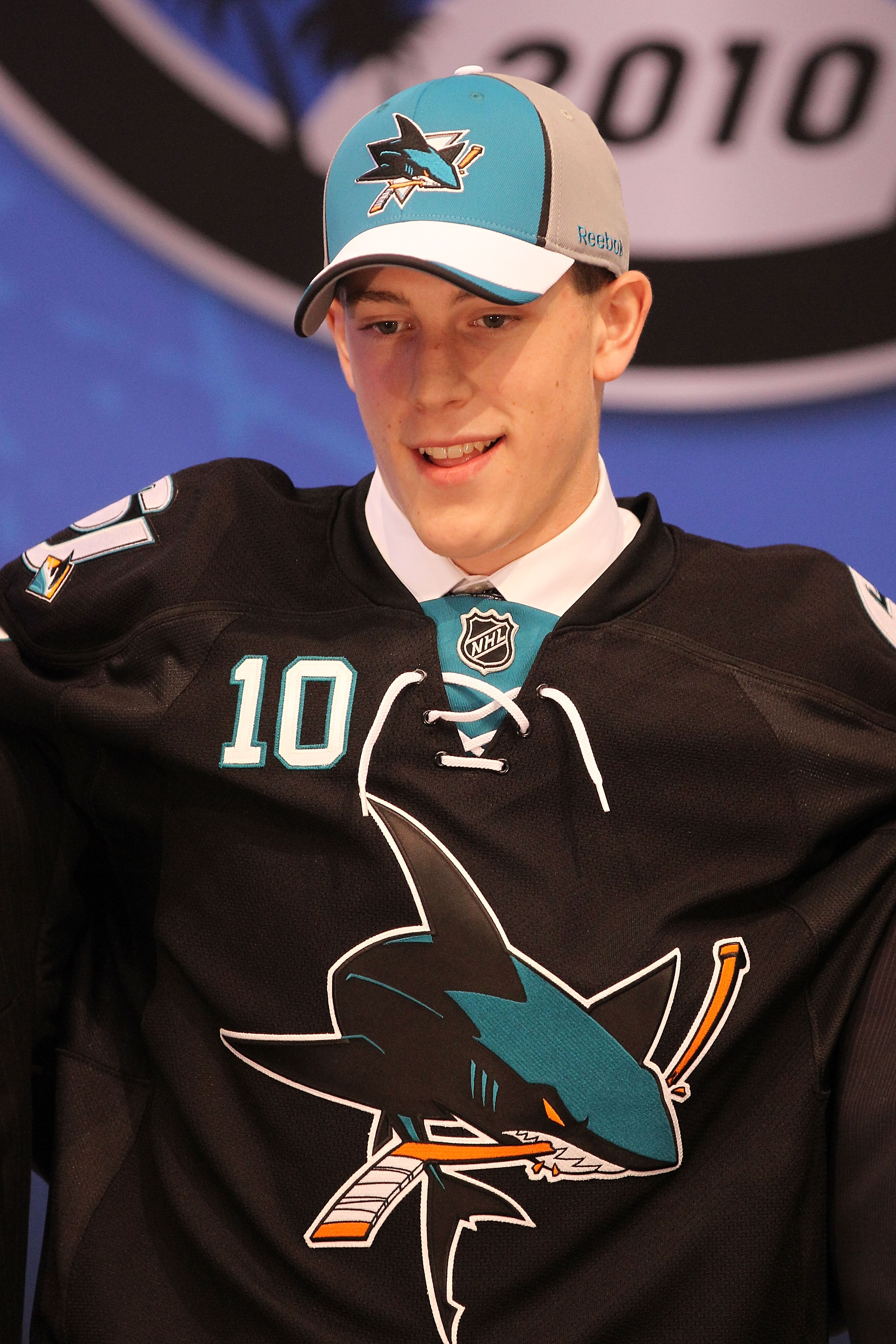LOS ANGELES, CA - JUNE 25:  Charlie Coyle, drafted 28th overall by the San Jose Sharks, stands on stage during the 2010 NHL Entry Draft at Staples Center on June 25, 2010 in Los Angeles, California.  (Photo by Bruce Bennett/Getty Images)
