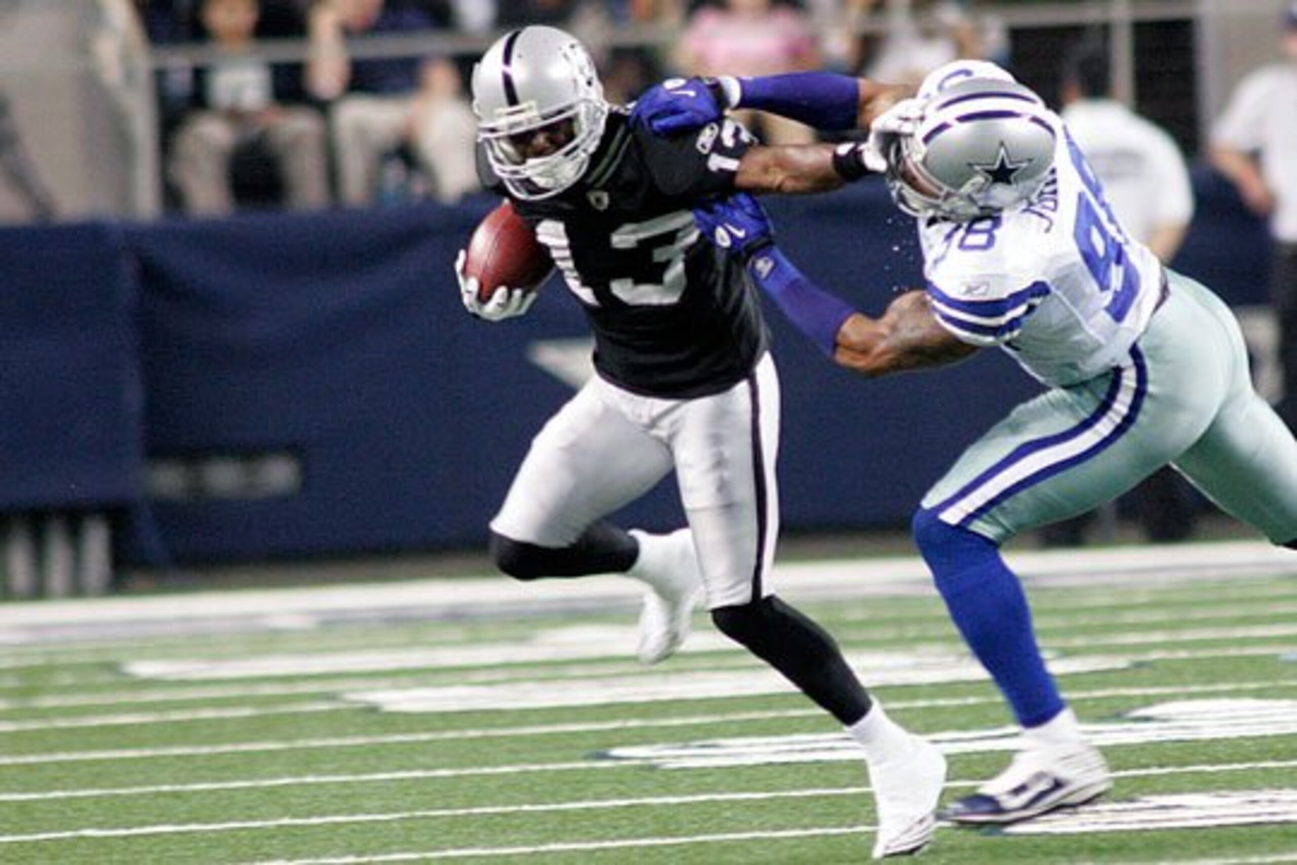 Yamon Figurs struggles for extra yards last Thursday in Dallas