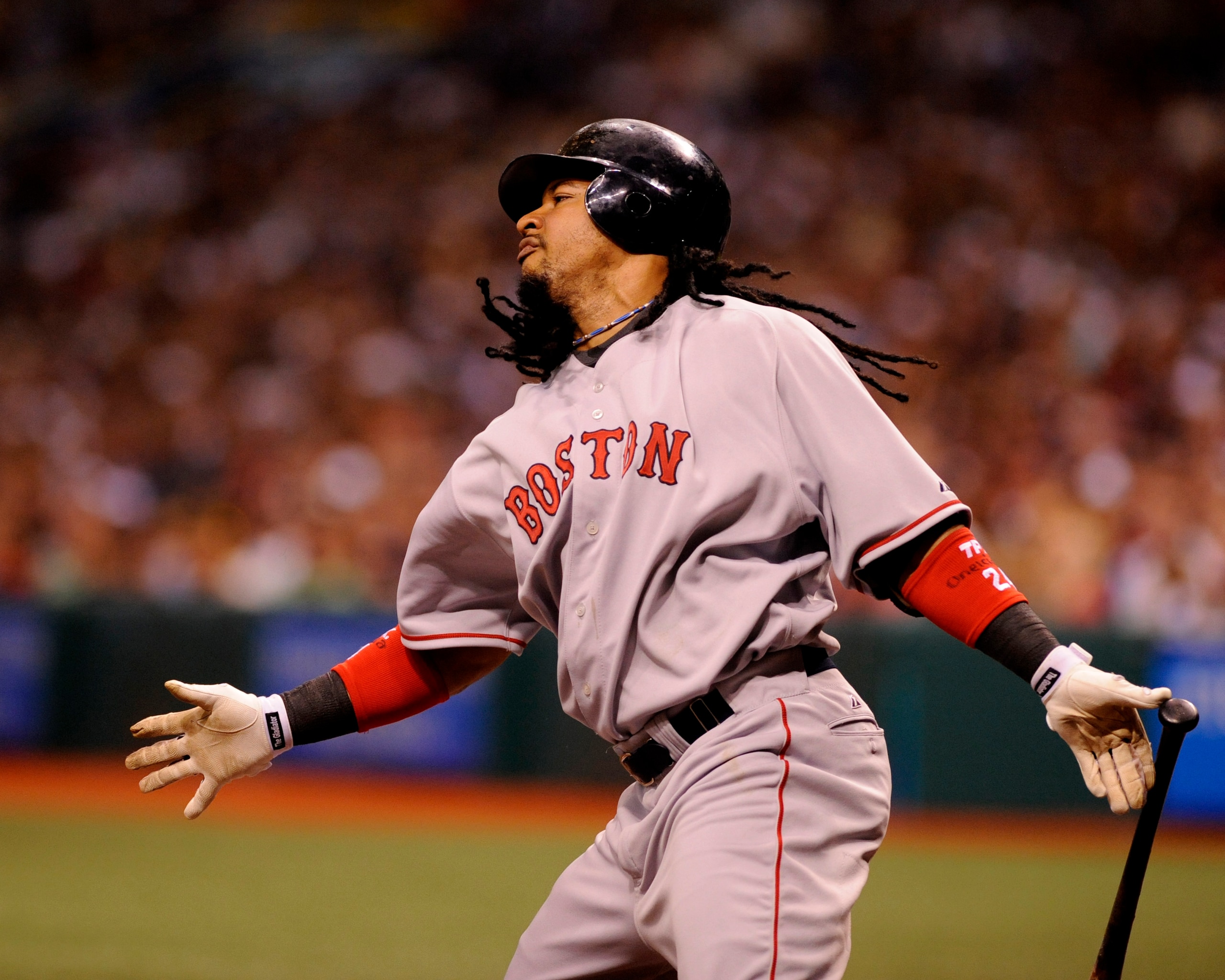 ST PETERSBURG, FL - July 2: Designated hitter Manny Ramirez #24 of the Boston Red Sox drives in a run against the Tampa Bay Rays July 2, 2008 at Tropicana Field in St. Petersburg, Florida.  (Photo by Al Messerschmidt/Getty Images)