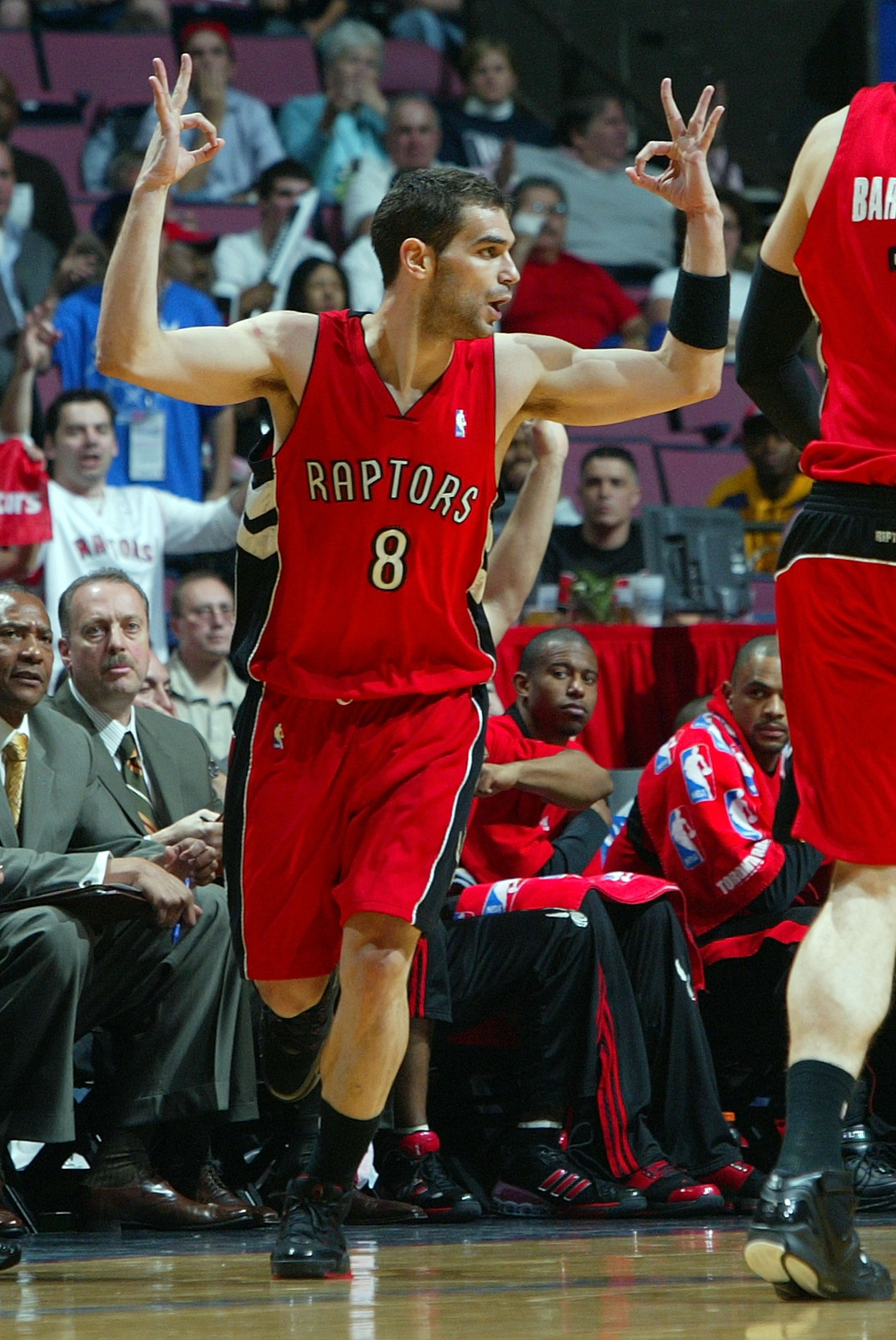 EAST RUTHERFORD, NJ - MAY 04:  Jose Calderon #8 of the Toronto Raptors reacts after a three pointer against the New Jersey Nets in Game Six of the Eastern Conference Quarterfinals during the 2007 NBA Playoffs on May 4, 2007 at the Continental Airlines Are