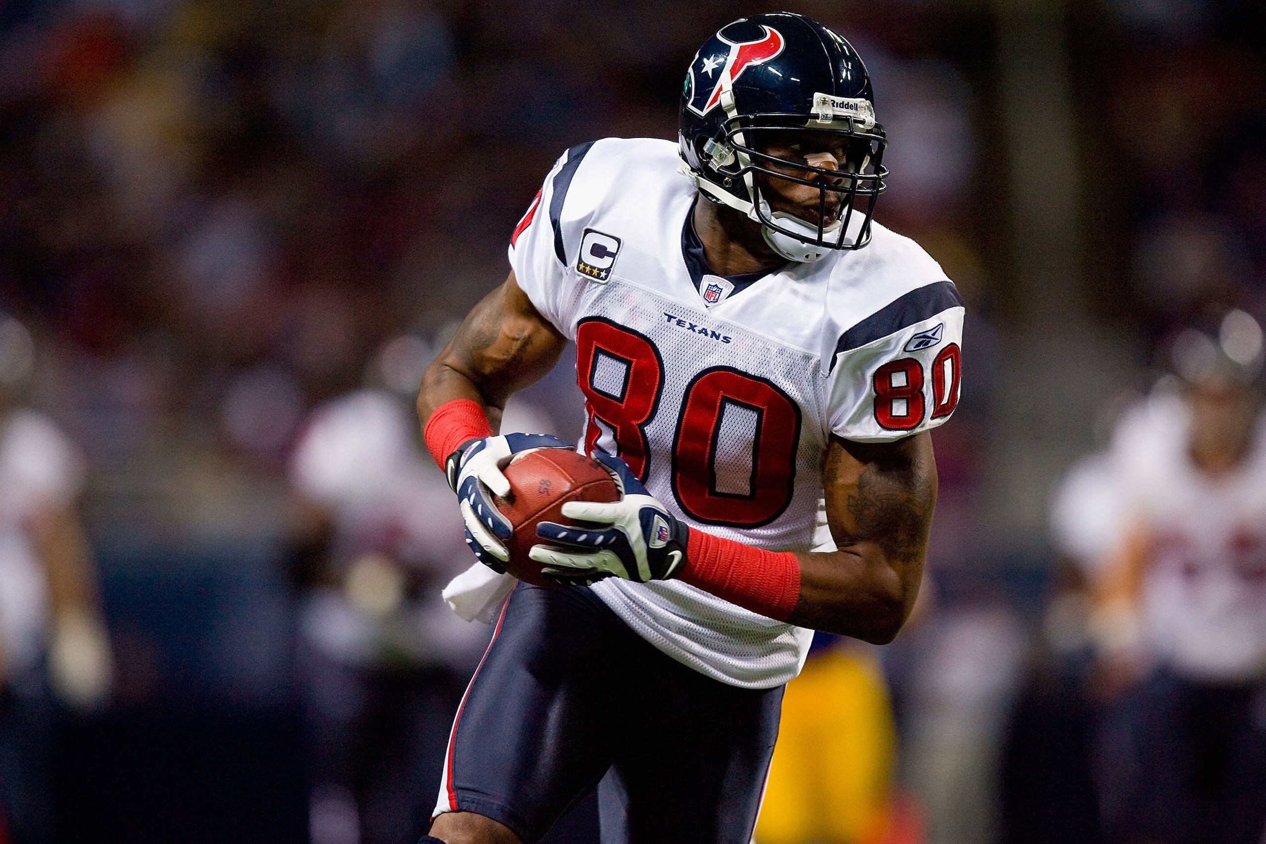 ST. LOUIS - DECEMBER 20:  Andre Johnson #80 of the Houston Texans carries the ball during the game against the St. Louis Rams at Edward Jones Dome on December 20, 2009 in St. Louis, Missouri.  (Photo by Dilip Vishwanat/Getty Images)
