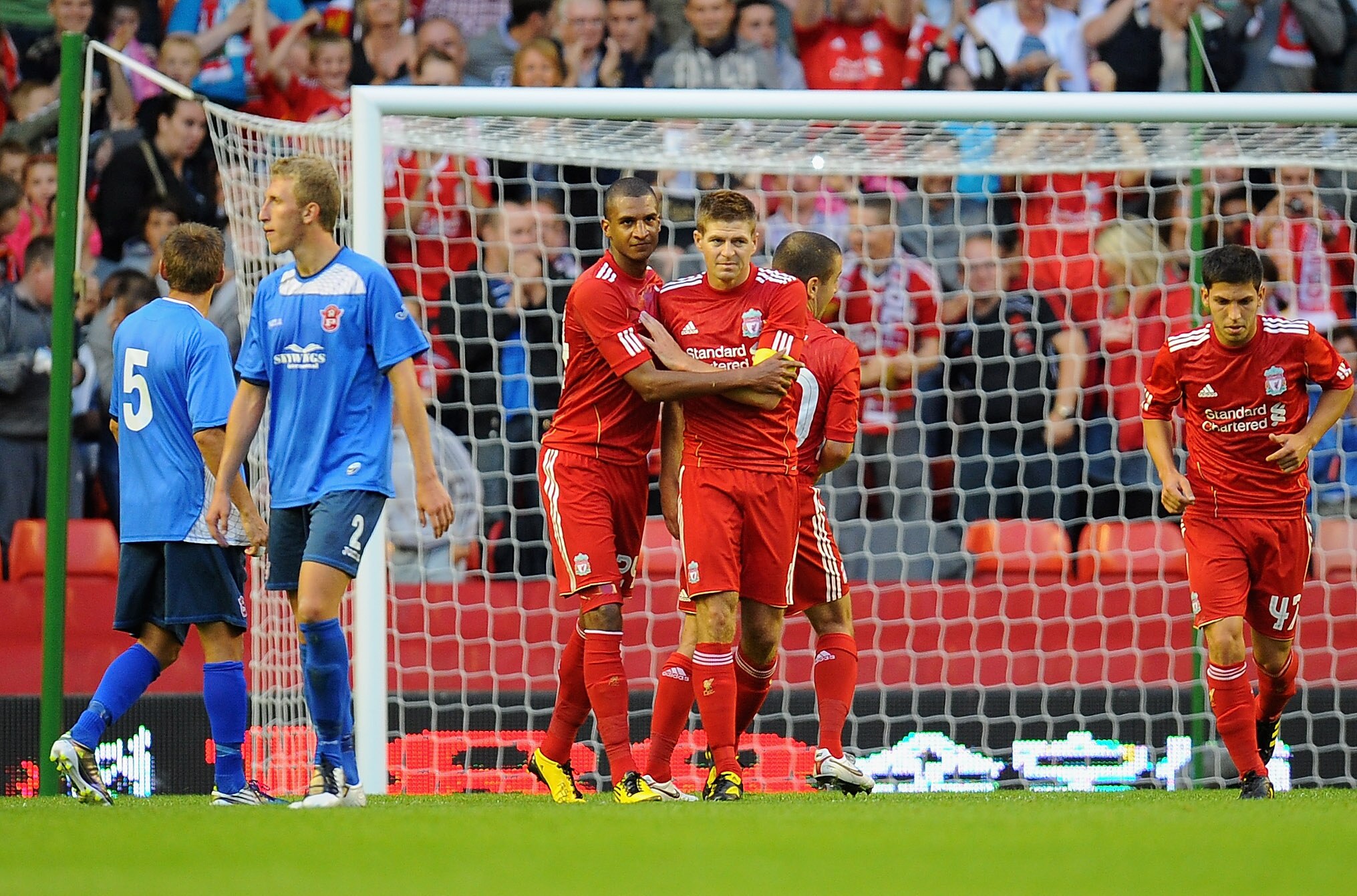 LIVERPOOL, ENGLAND - AUGUST 05:  David Ngog and Steven Gerrard of Liverpool celebrate Gerrard's goal during the Europa League, Third Qualifying Round, Second Leg match between Liverpool and FK Rabotnicki at Anfield on August 5, 2010 in Liverpool, England.