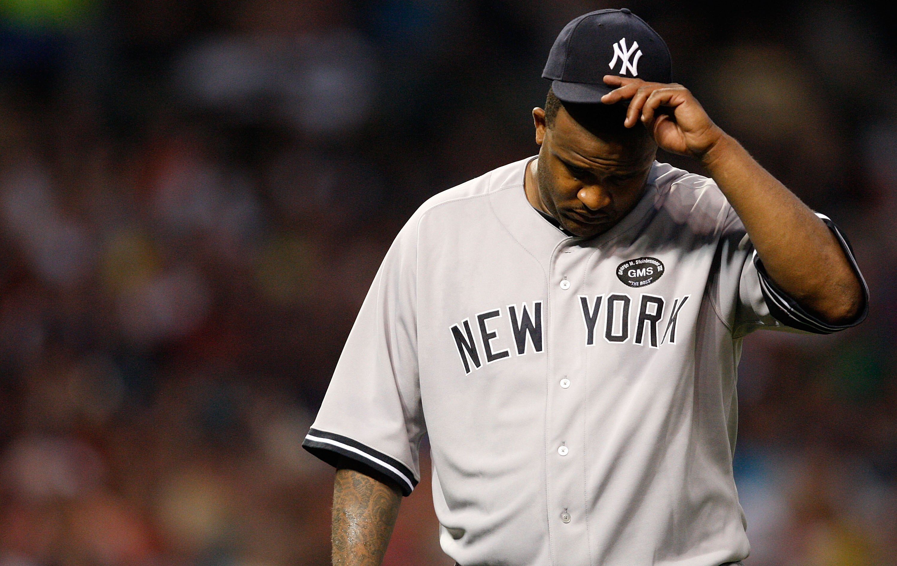 CLEVELAND - JULY 27:  CC Sabathia #52 of the New York Yankees walks back to the dugout at the end of an inning during the game against the Cleveland Indians on July 27, 2010 at Progressive Field in Cleveland, Ohio.  (Photo by Jared Wickerham/Getty Images)