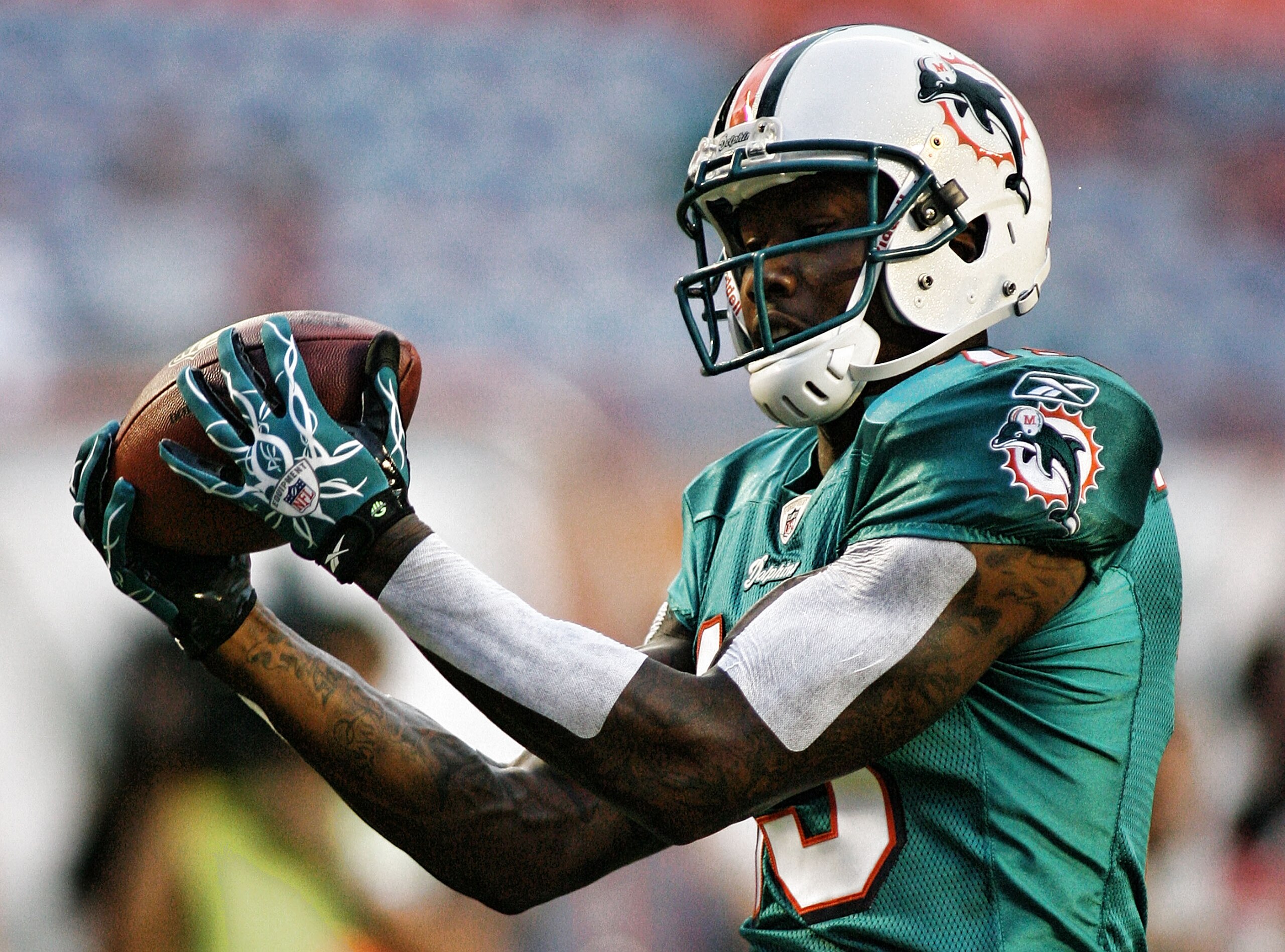 MIAMI - AUGUST 14:  Wide Receiver Brandon Marshall #19 of the Miami Dolphins warms up prior to playing the Tampa Bay Buccaneers in a preseason game at Sun Life Stadium on August 14, 2010 in Miami, Florida.  (Photo by Marc Serota/Getty Images)