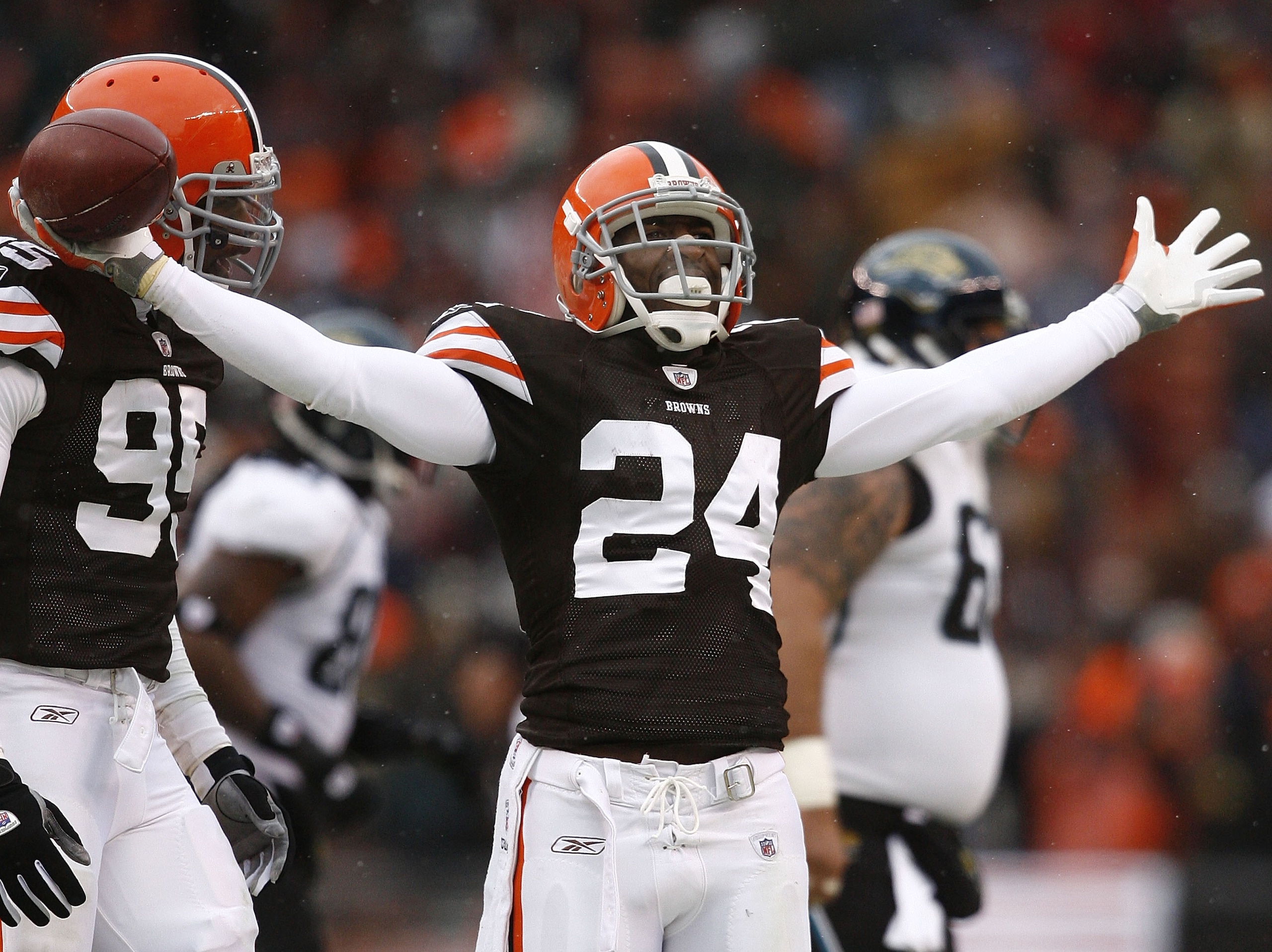 CLEVELAND - JANUARY 03:  Eric Wright #24 of the Cleveland Browns celebrates with Kamerion Wimbley #95 after an interception against the Jacksonville Jaguars at Cleveland Browns Stadium on January 3, 2010 in Cleveland, Ohio.  (Photo by Matt Sullivan/Getty