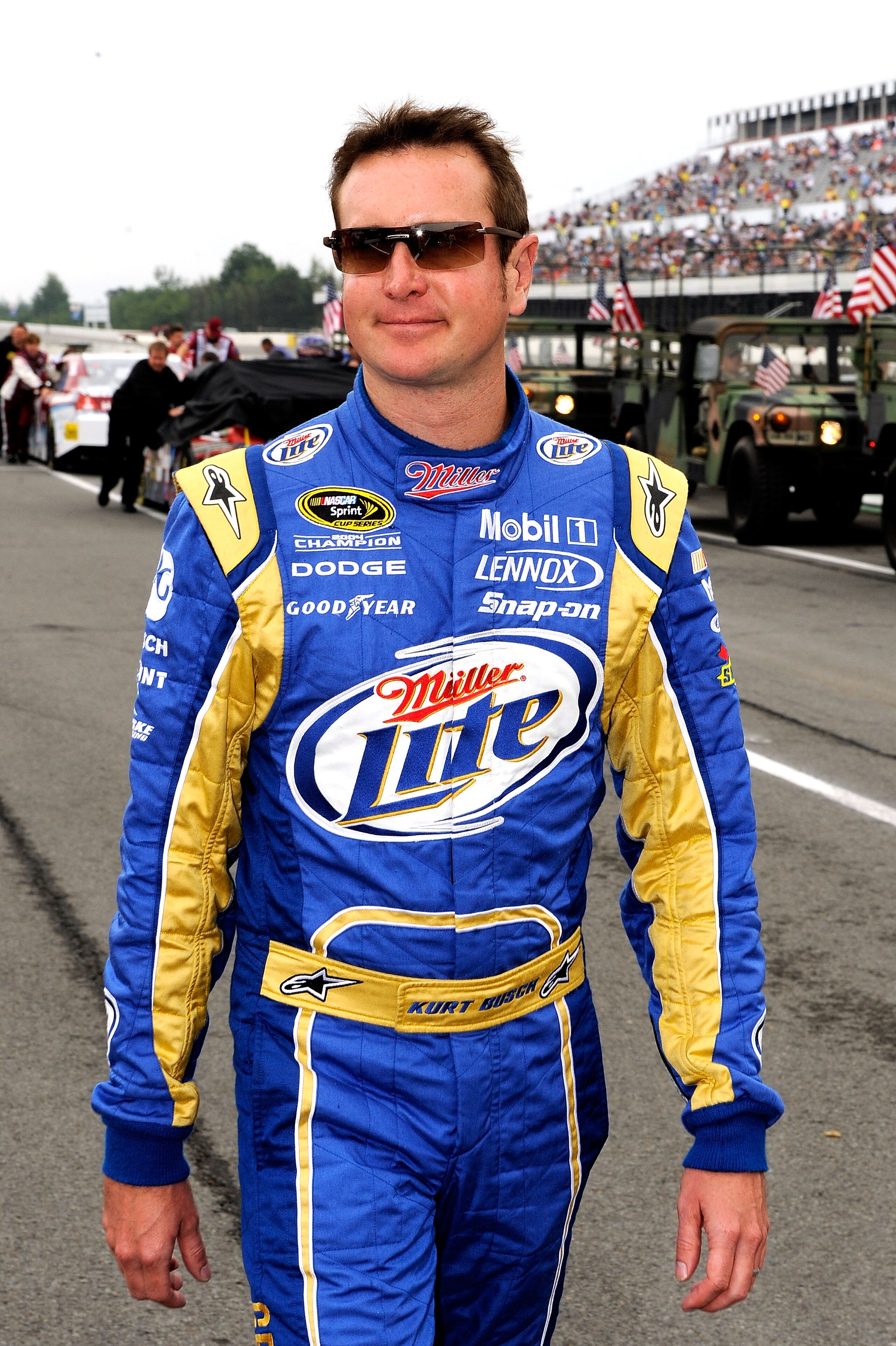 LONG POND, PA - AUGUST 01:  Kurt Busch, driver of the #2 Miller Lite/Vortex Dodge, walks on the grid prior to the NASCAR Sprint Cup Series Sunoco Red Cross Pennsylvania 500 at Pocono Raceway on August 1, 2010 in Long Pond, Pennsylvania.  (Photo by Rusty J