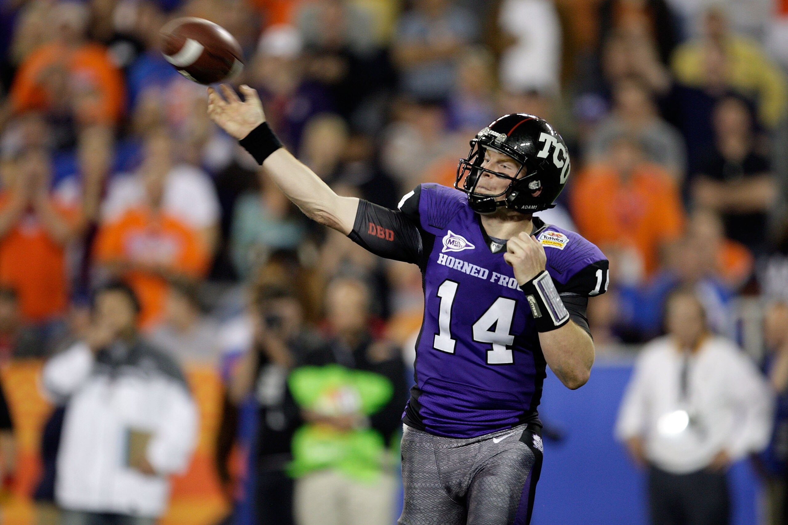 GLENDALE, AZ - JANUARY 04:  Quarterback Andy Dalton #14 of the TCU Horned Frogs passes the ball against the Boise State Broncos during the Tostitos Fiesta Bowl at the Universtity of Phoenix Stadium on January 4, 2010 in Glendale, Arizona.  (Photo by Jamie
