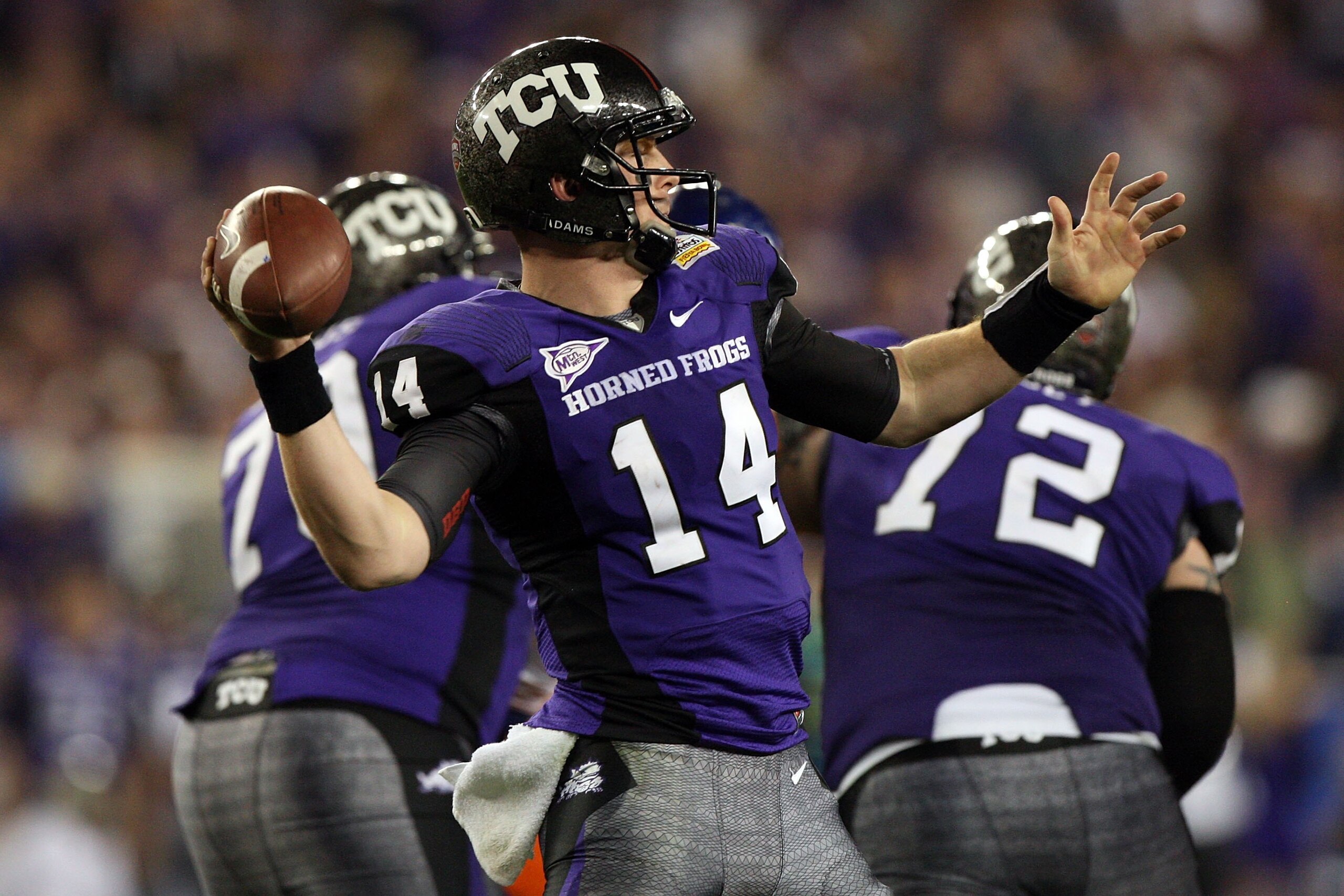 GLENDALE, AZ - JANUARY 04:  Quarterback Andy Dalton #14 of the TCU Horned Frogs passes the ball against the Boise State Broncos during the Tostitos Fiesta Bowl at the Universtity of Phoenix Stadium on January 4, 2010 in Glendale, Arizona.  (Photo by Jed J