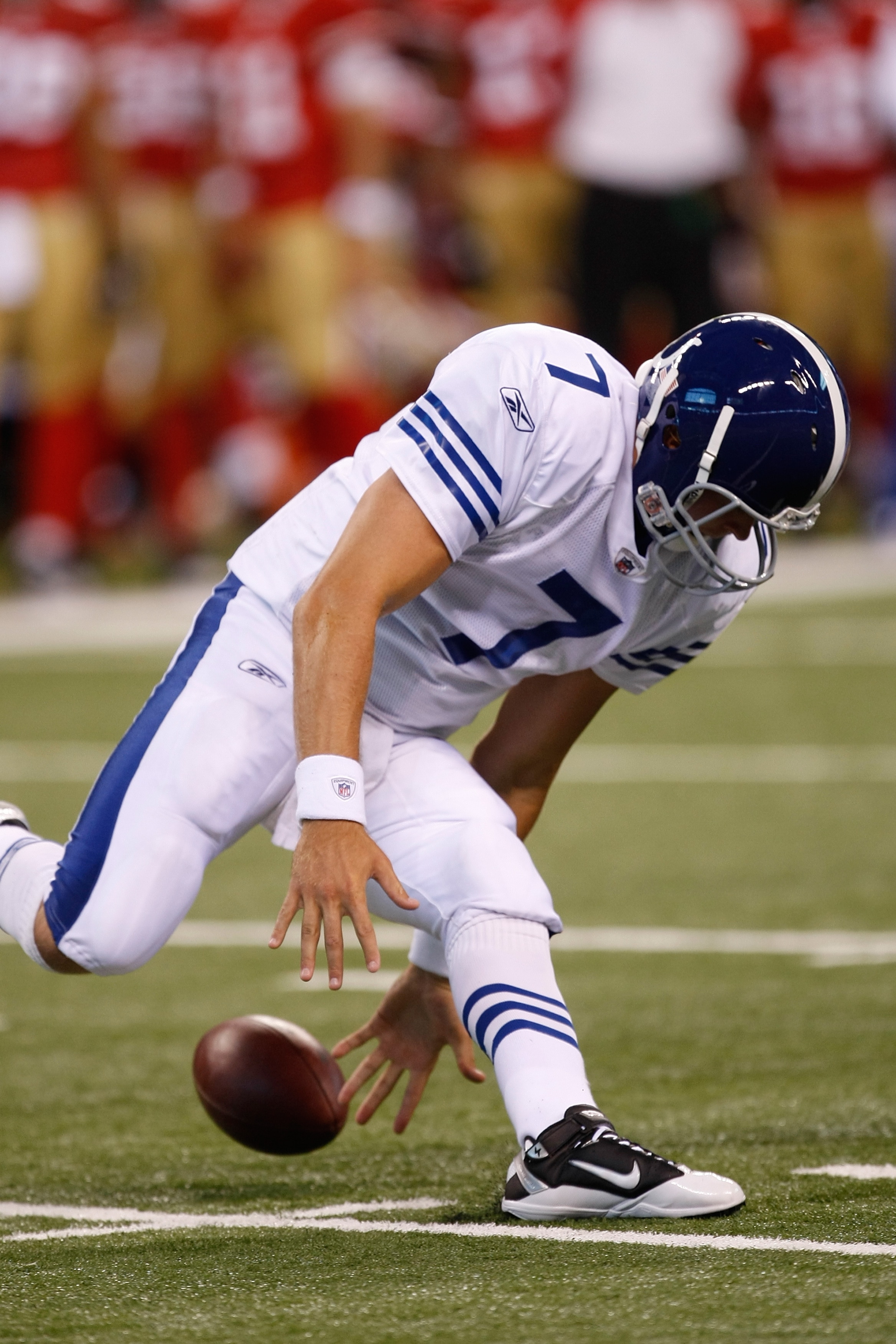 INDIANAPOLIS, IN - AUGUST 15: Curtis Painter #7 of the Indianapolis Colts fumbles during the preseason game against the San Francisco 49ers at Lucas Oil Stadium on August 15, 2010 in Indianapolis, Indiana.  (Photo by Scott Boehm/Getty Images)