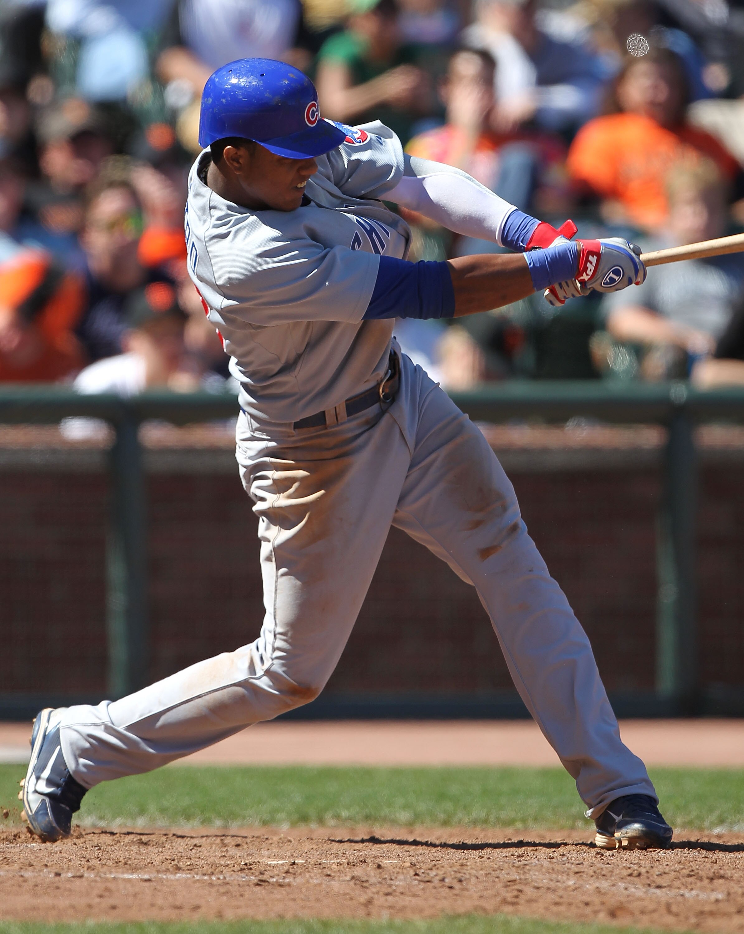 SAN FRANCISCO - AUGUST 12:  Starlin Castro #13 of the Chicago Cubs singles in the eighth inning against the San Francisco Giant during an MLB game at AT&T Park on August 12, 2010 in San Francisco, California.  (Photo by Jed Jacobsohn/Getty Images)