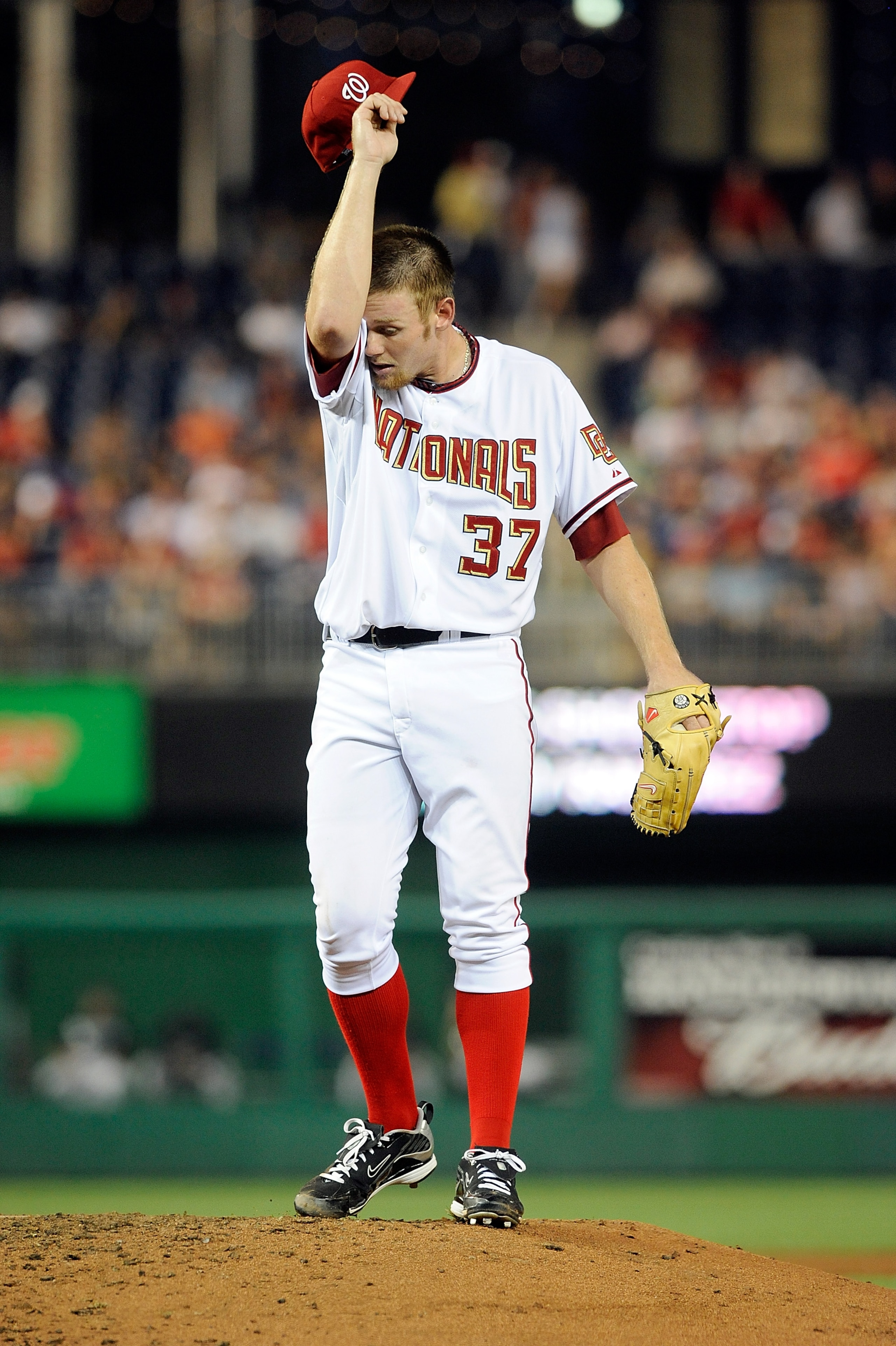 WASHINGTON - AUGUST 10:  Stephen Strasburg #37 of the Washington Nationals wipes his forehead during the game against the Florida Marlins at Nationals Park on August 10, 2010 in Washington, DC.  (Photo by Greg Fiume/Getty Images)