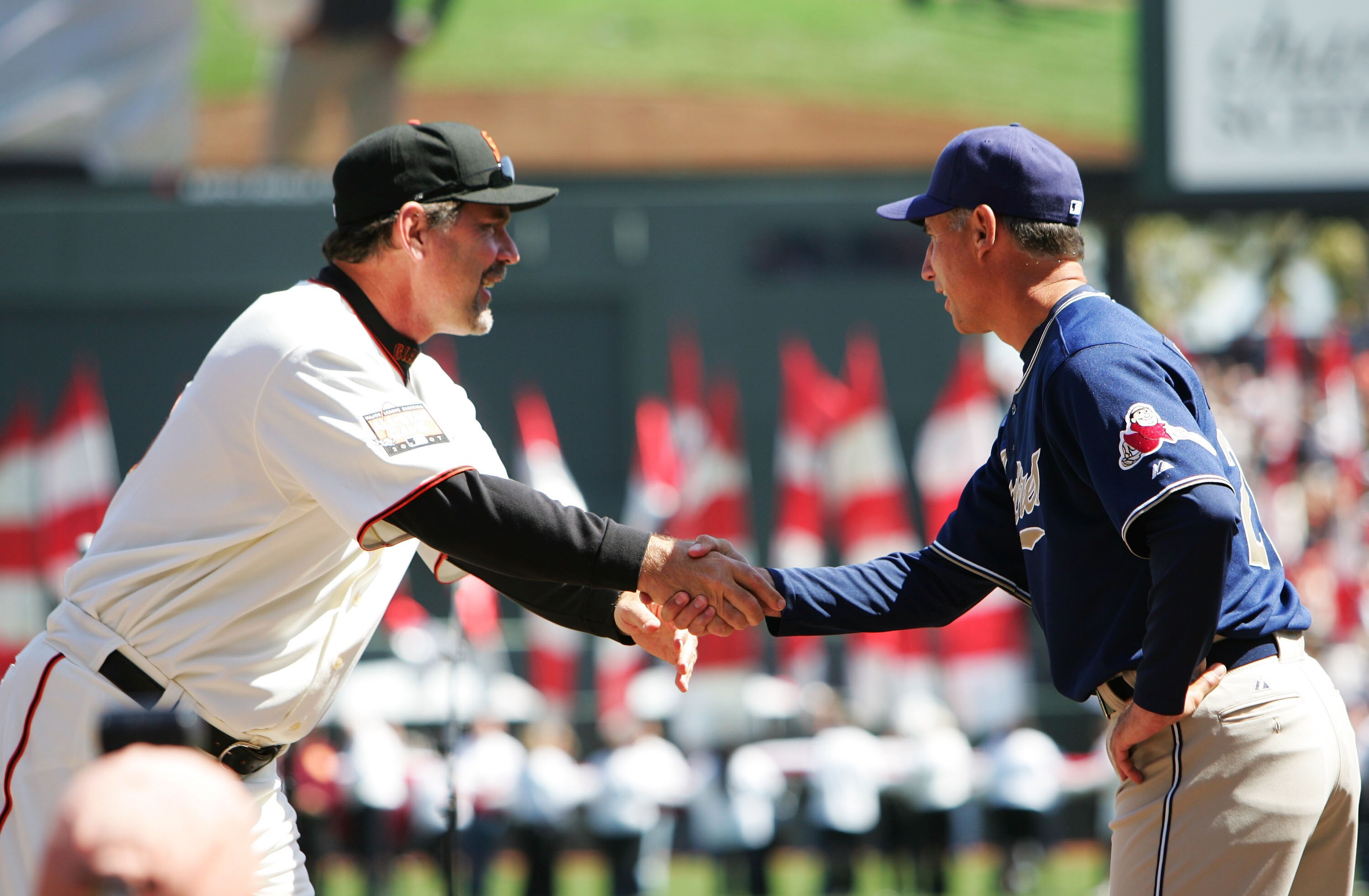 SAN FRANCISCO - APRIL 03:  Manager Bruce Bochy of the San Francisco Giants greets Manager Bud Black of the San Diego Padres during pregame ceremonies on the Opening Day of Major League Baseball on April 3, 2007 at AT&T Park in San Francisco, California.
