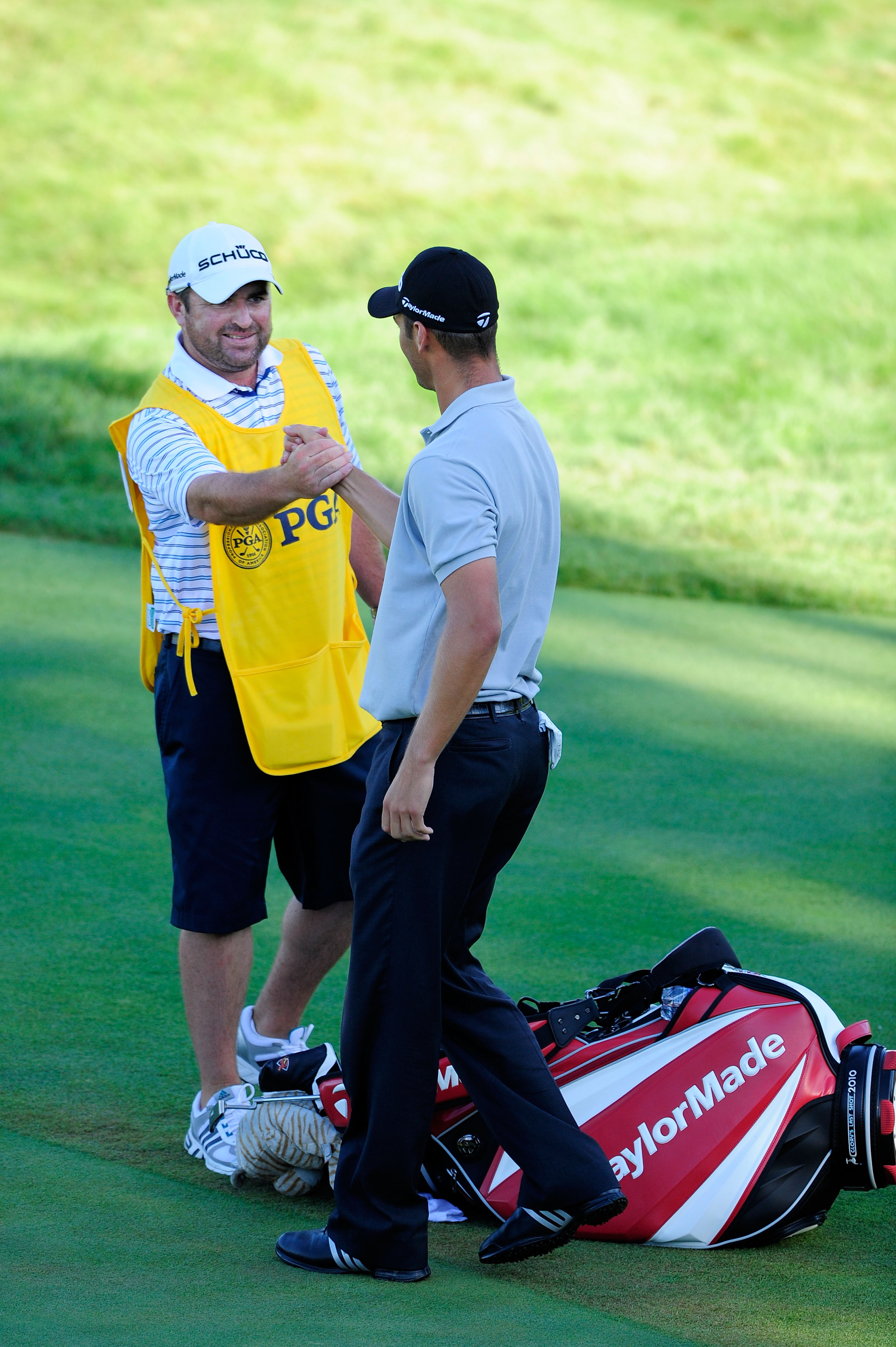 KOHLER, WI - AUGUST 15:  Martin Kaymer of Germany (R) and his caddie Craig Connelly celebrate on the 18th green during the final round of the 92nd PGA Championship on the Straits Course at Whistling Straits on August 15, 2010 in Kohler, Wisconsin.  (Photo