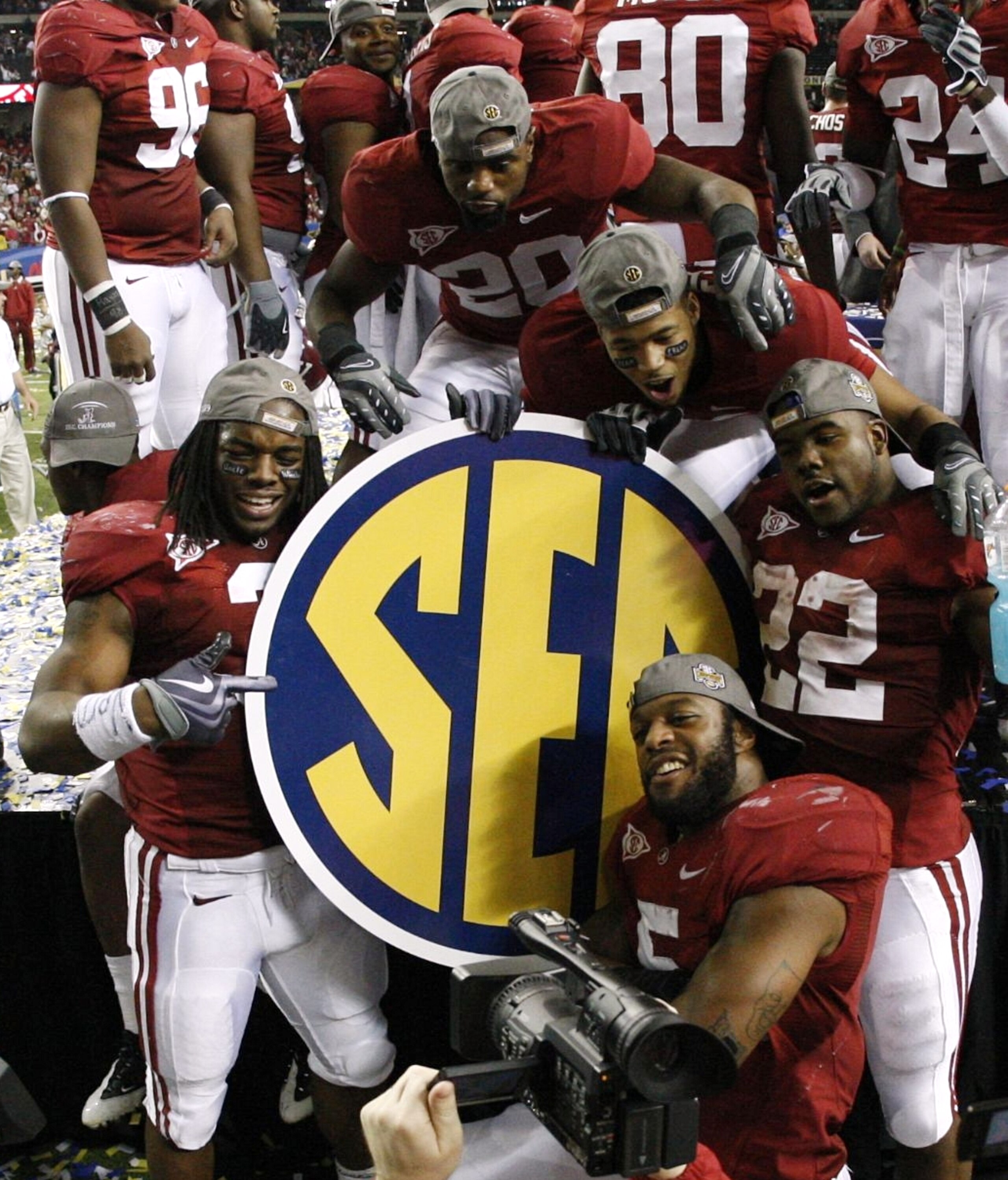 ATLANTA - DECEMBER 5:  (Clockwise from top) Tyrone King #20, Robby Green #23, Mark Ingram #22, Roy Upchurch #5 and Kareem Jackson #3 of the Alabama Crimson Tide celebrate after their 32-13 win against the Florida Gators during the SEC Championship game at
