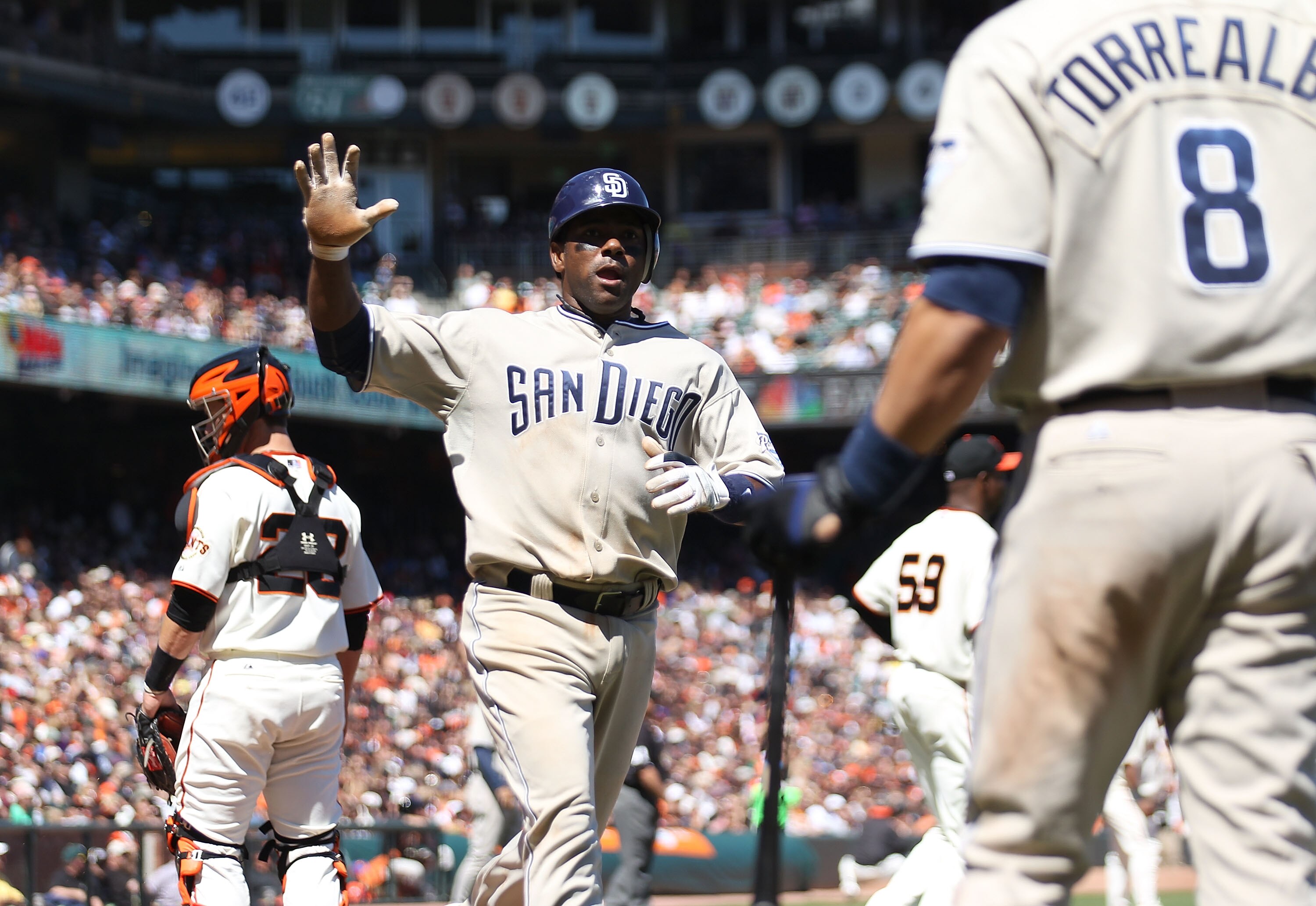 SAN FRANCISCO - AUGUST 15:  Miguel Tejada #10 of the San Diego Padres scores on a single hit by Ryan Ludwick against the San Francisco Giants in the sixth inning during an MLB game at AT&T Park on August 15, 2010 in San Francisco, California.  (Photo by J